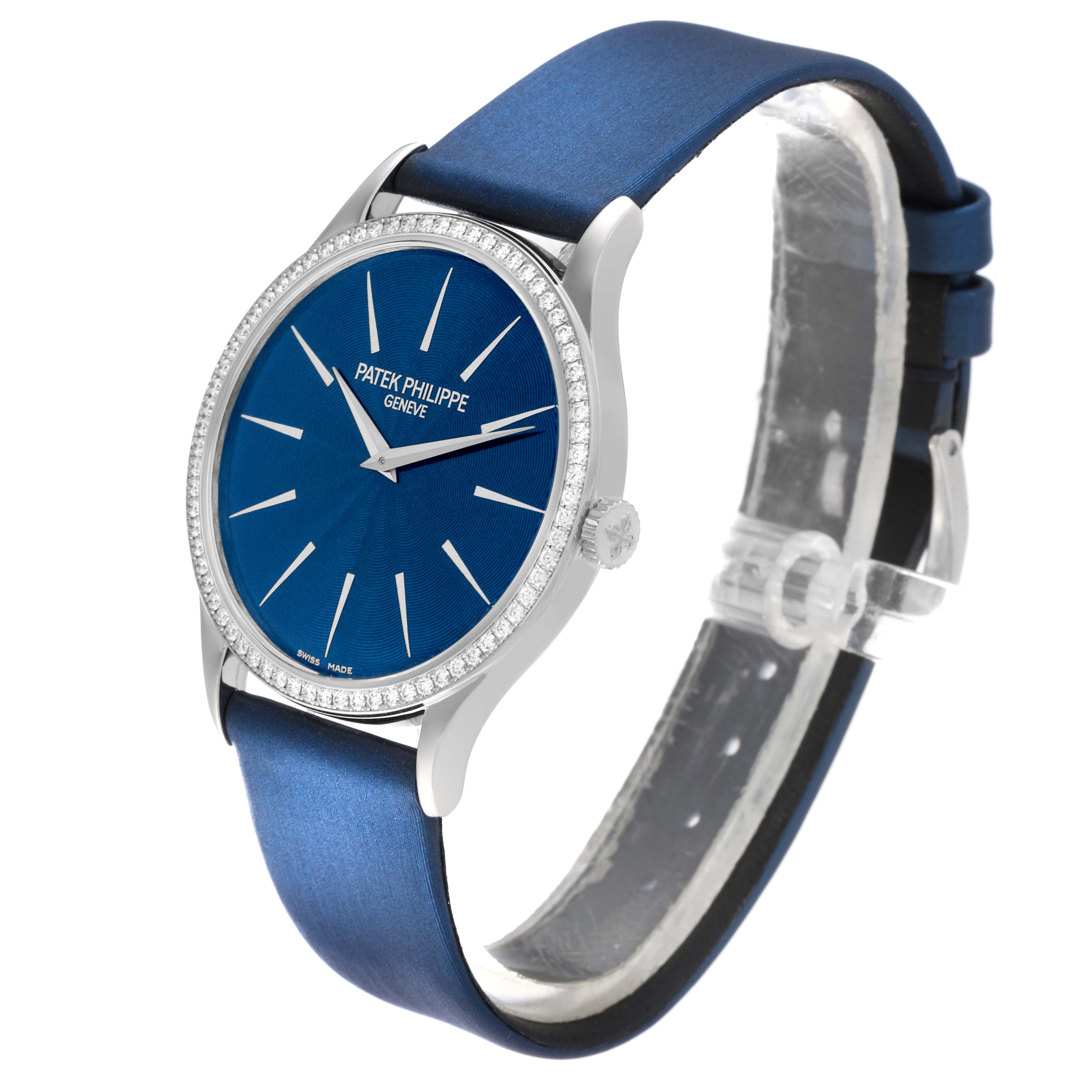 The image shows a Patek Philippe Calatrava 4897G-001 Women's White Gold Blue Dial 4897G-001 Women's White Gold Blue Dial watch angled slightly to the right, highlighting its blue dial, diamond bezel, and blue strap.