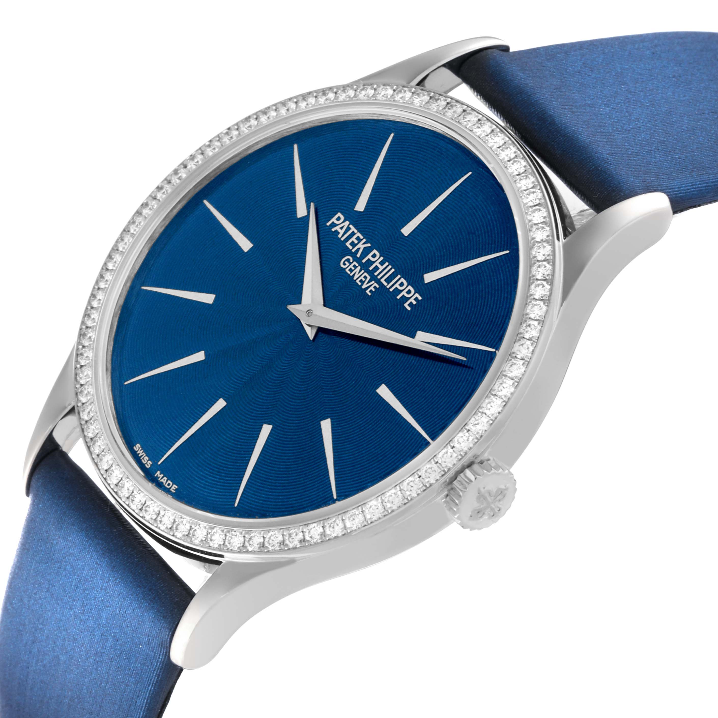 The image shows a side angle of the Patek Philippe Calatrava 4897G-001 Women's White Gold Blue Dial 4897G-001 Women's White Gold Blue Dial watch, highlighting its blue dial, silver indices, and crown.