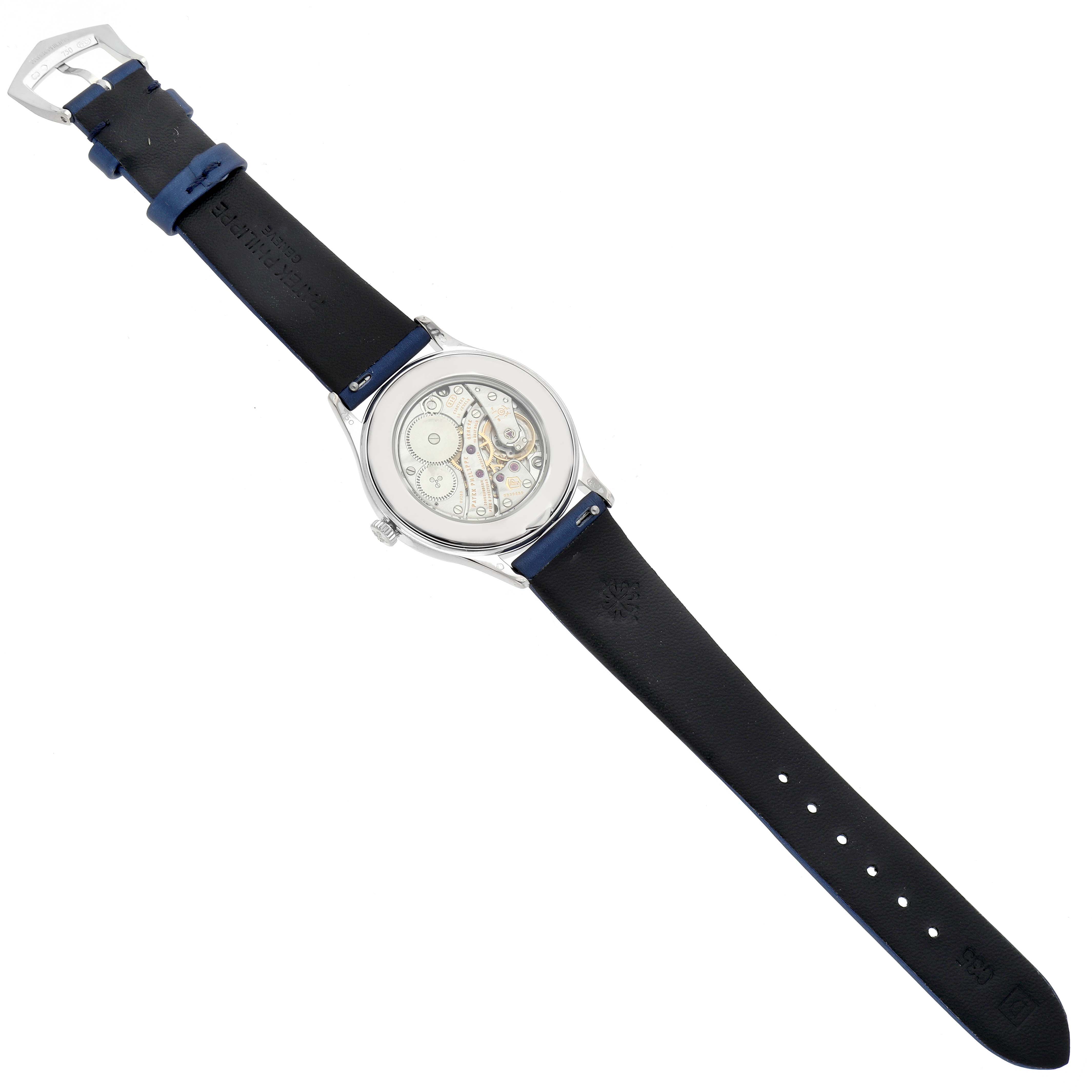 The image shows the back view of the Patek Philippe Calatrava 4897G-001 Women's White Gold Blue Dial 4897G-001 Women's White Gold Blue Dial watch, revealing the mechanism and the strap.