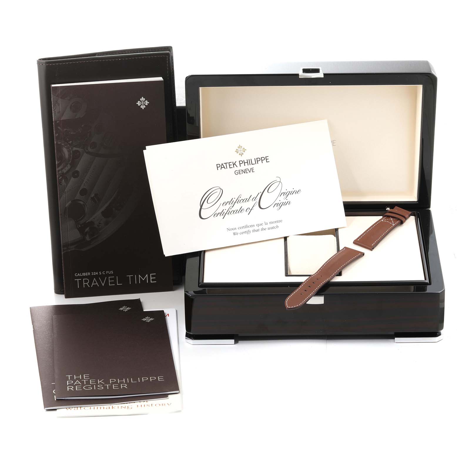 This image shows a Patek Philippe Calatrava 5524G-001 Men's White Gold Blue Dial 5524G-001 Men's White Gold Blue Dial watch box, strap, pamphlets, and a Certificate of Origin, all from a front view.