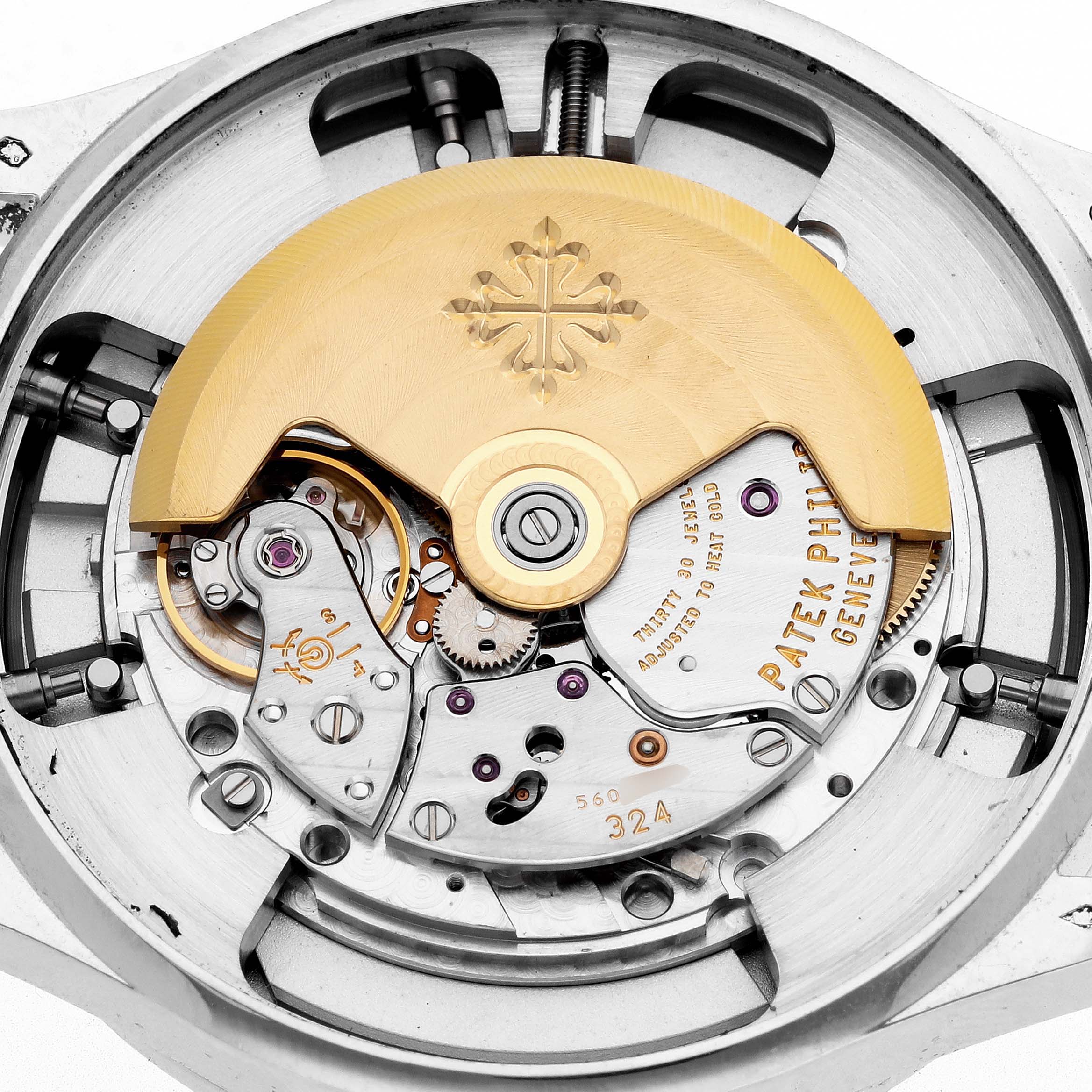 The image shows the intricate movement of a Patek Philippe Complications 5496P-004 Men
s Platinum Silver Dial model from a top-down angle, highlighting the rotor and gears.