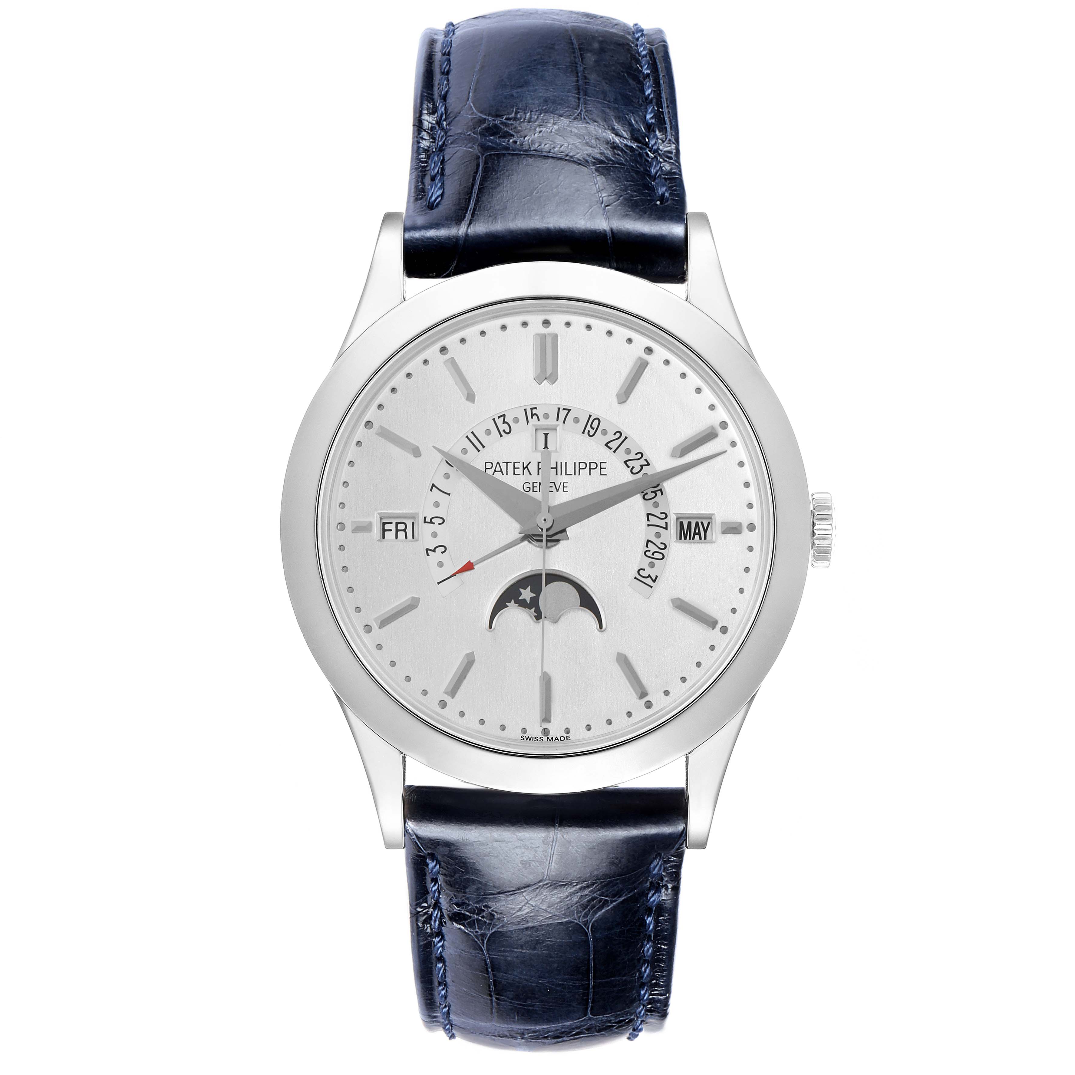 The image shows a front view of the Patek Philippe Complications 5496P-004 Men
s Platinum Silver Dial watch, highlighting its moon phase, date, and day indicators.