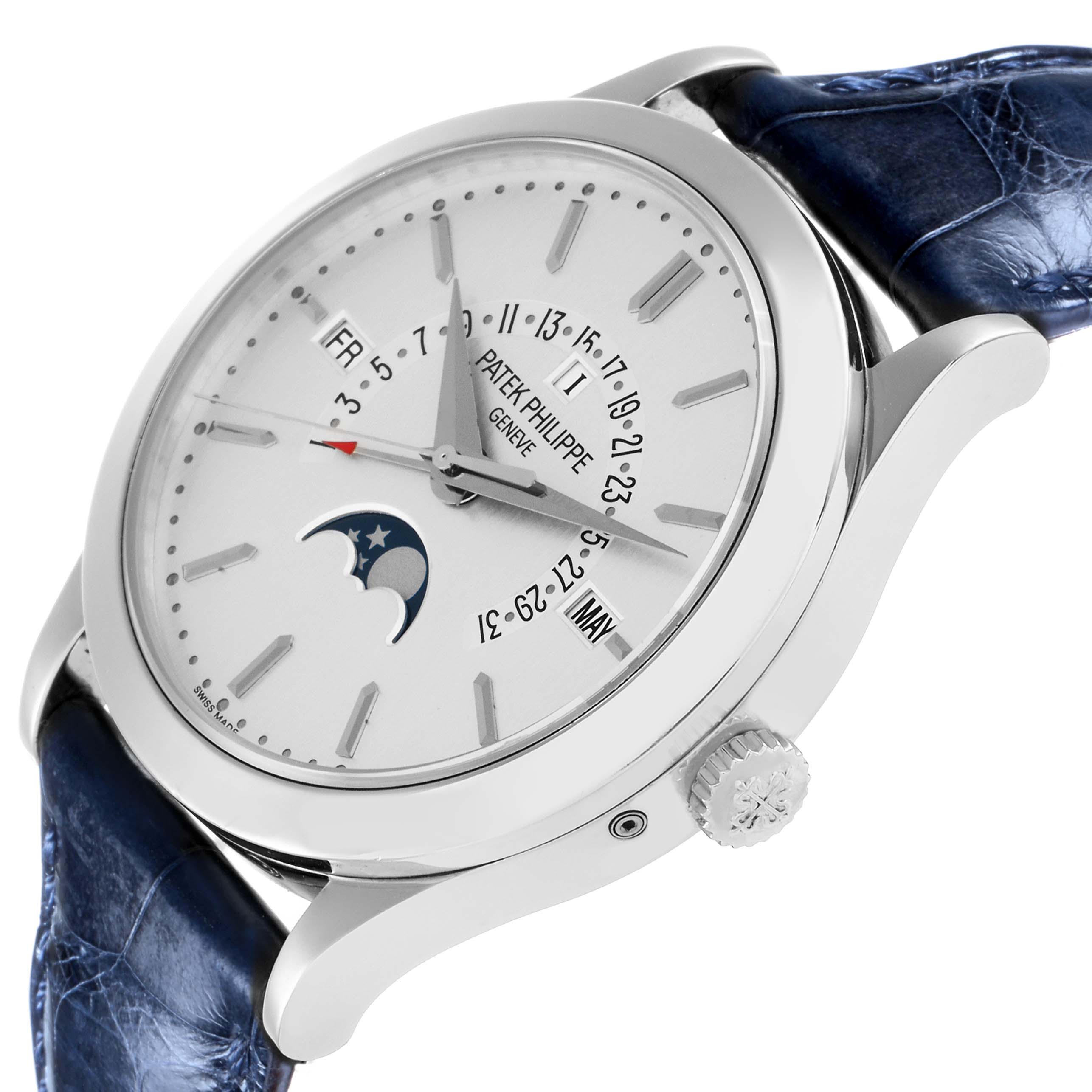 The Patek Philippe Complications 5496P-004 Men
s Platinum Silver Dial watch is shown from a side angle, highlighting the dial, crown, and blue leather strap.