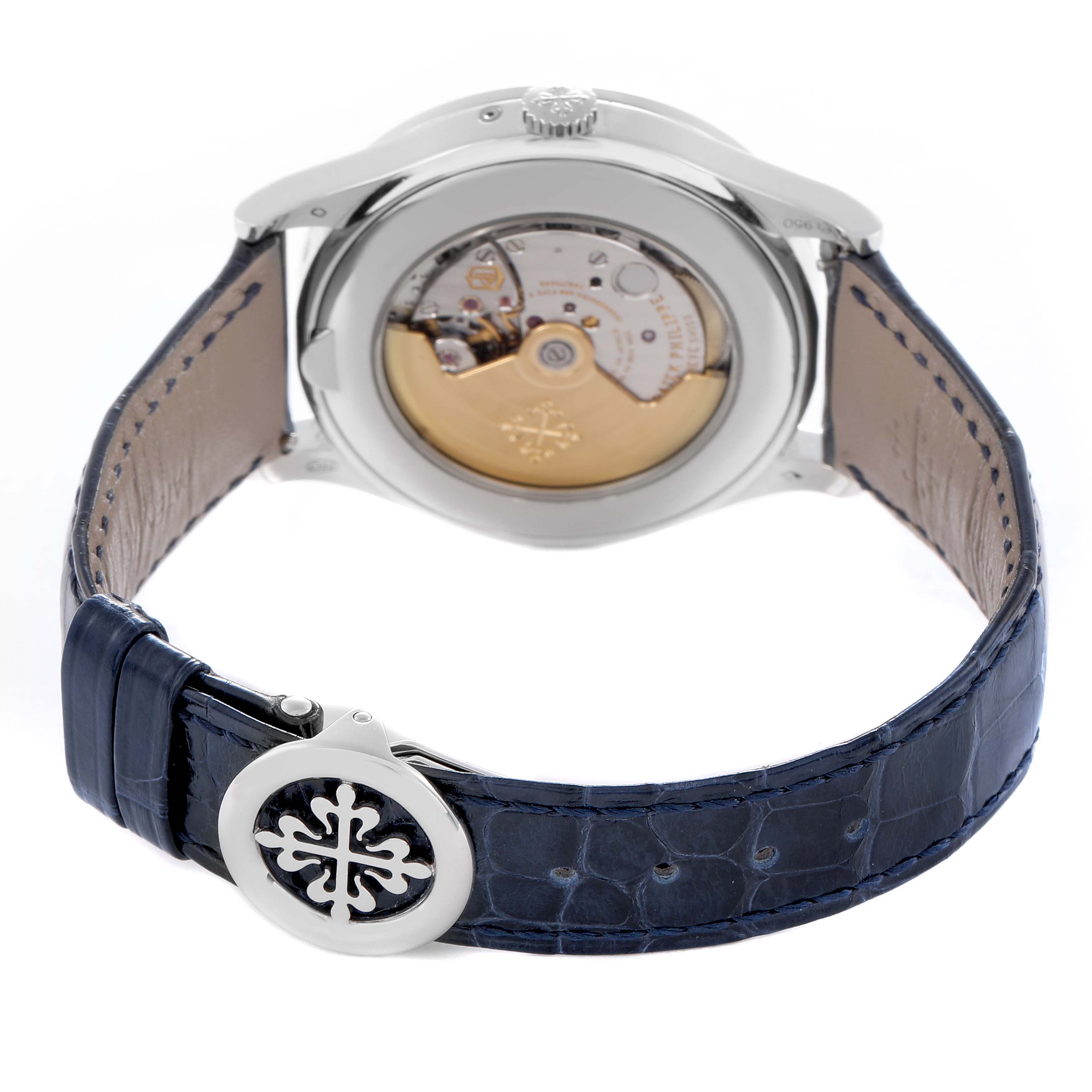 The Patek Philippe Complications 5496P-004 Men
s Platinum Silver Dial watch is shown from the back, highlighting the movement and leather strap.