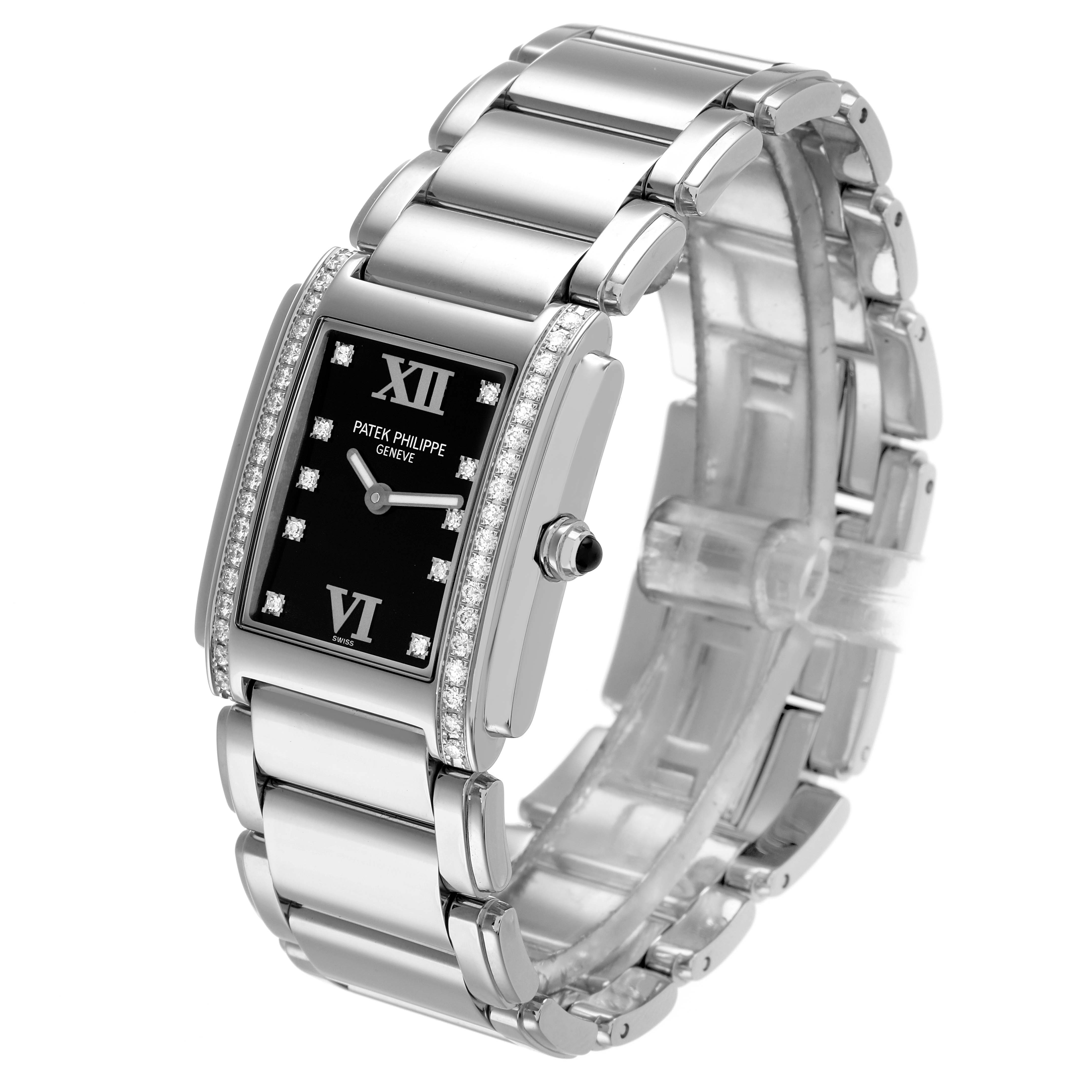 The Patek Philippe Twenty-4 4910 Women
s Stainless Steel Black Dial watch is shown from a three-quarter angle, displaying its rectangular face, diamond bezel, and metal bracelet.