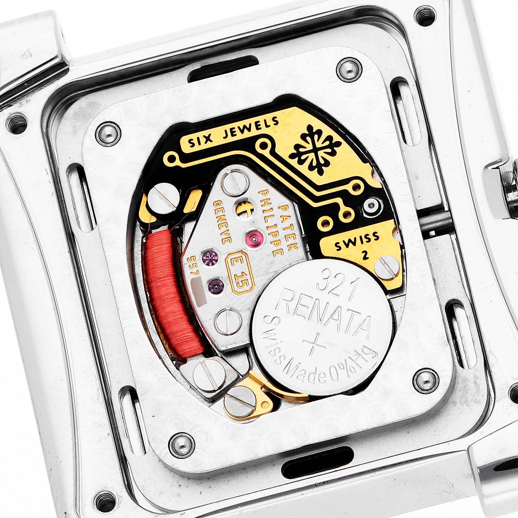 The image shows the back of a Patek Philippe Twenty-4 4910 Women
s Stainless Steel Black Dial watch, revealing its intricate movement and battery components.