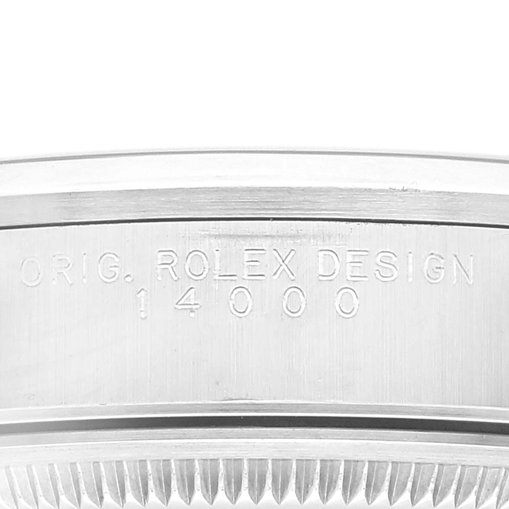 This image shows a close-up of the side view of a Rolex Air-King 14000 Men's Stainless Steel Blue Dial 14000 Men's Stainless Steel Blue Dial watch case with the engraving "ORIG. ROLEX DESIGN 14000".