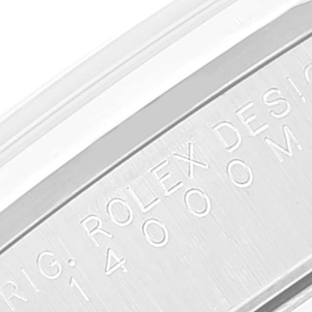Close-up of the side of a Rolex Air-King 14000M Men's Stainless Steel Black Dial 14000M Men's Stainless Steel Black Dial watch showing engraved text on the case.