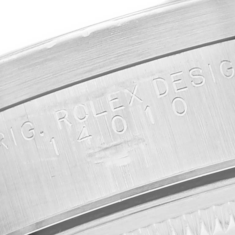 This close-up image shows the engraved inner bezel of the Rolex Air-King 14010 Men's Stainless Steel Black Dial 14010 Men's Stainless Steel Black Dial watch with its model number.