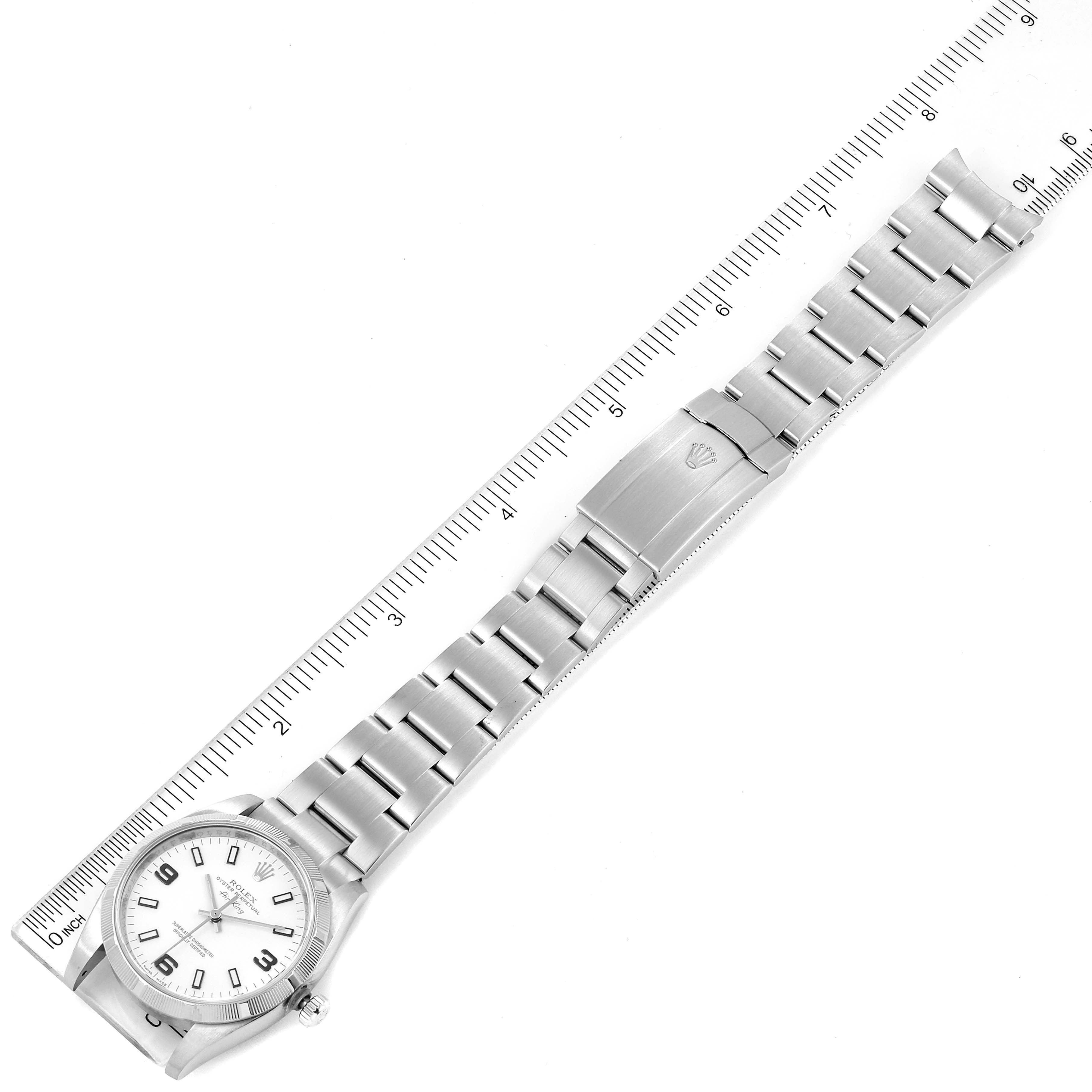 The image shows the entire watch face and bracelet of the Rolex Air-King 114210 Men's Stainless Steel White Dial 114210 Men's Stainless Steel White Dial laid out flat against a ruler.
