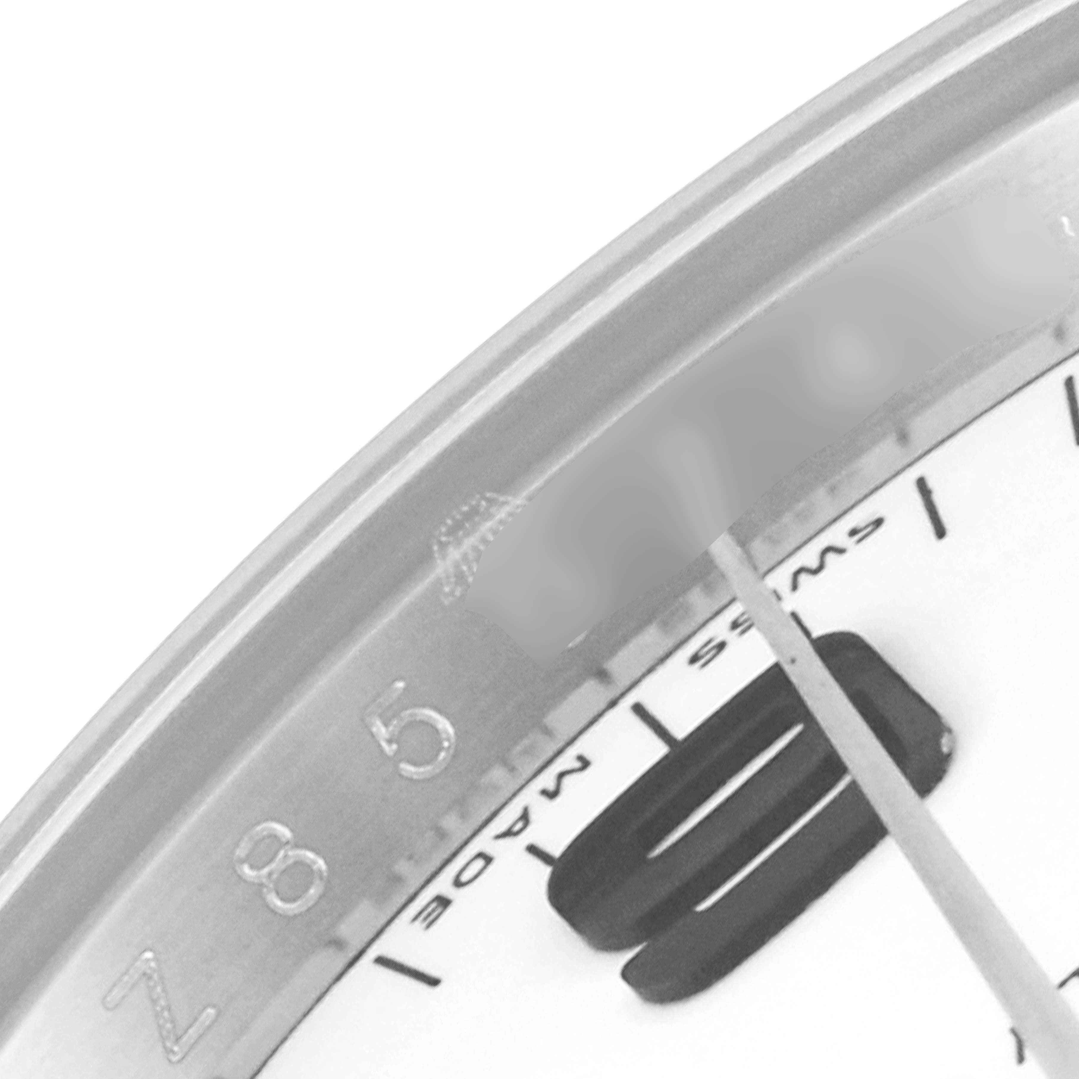 This image shows a close-up of the dial and bezel of a Rolex Air-King 114210 Men's Stainless Steel White Dial 114210 Men's Stainless Steel White Dial watch, highlighting parts of the hour markers and numerals.