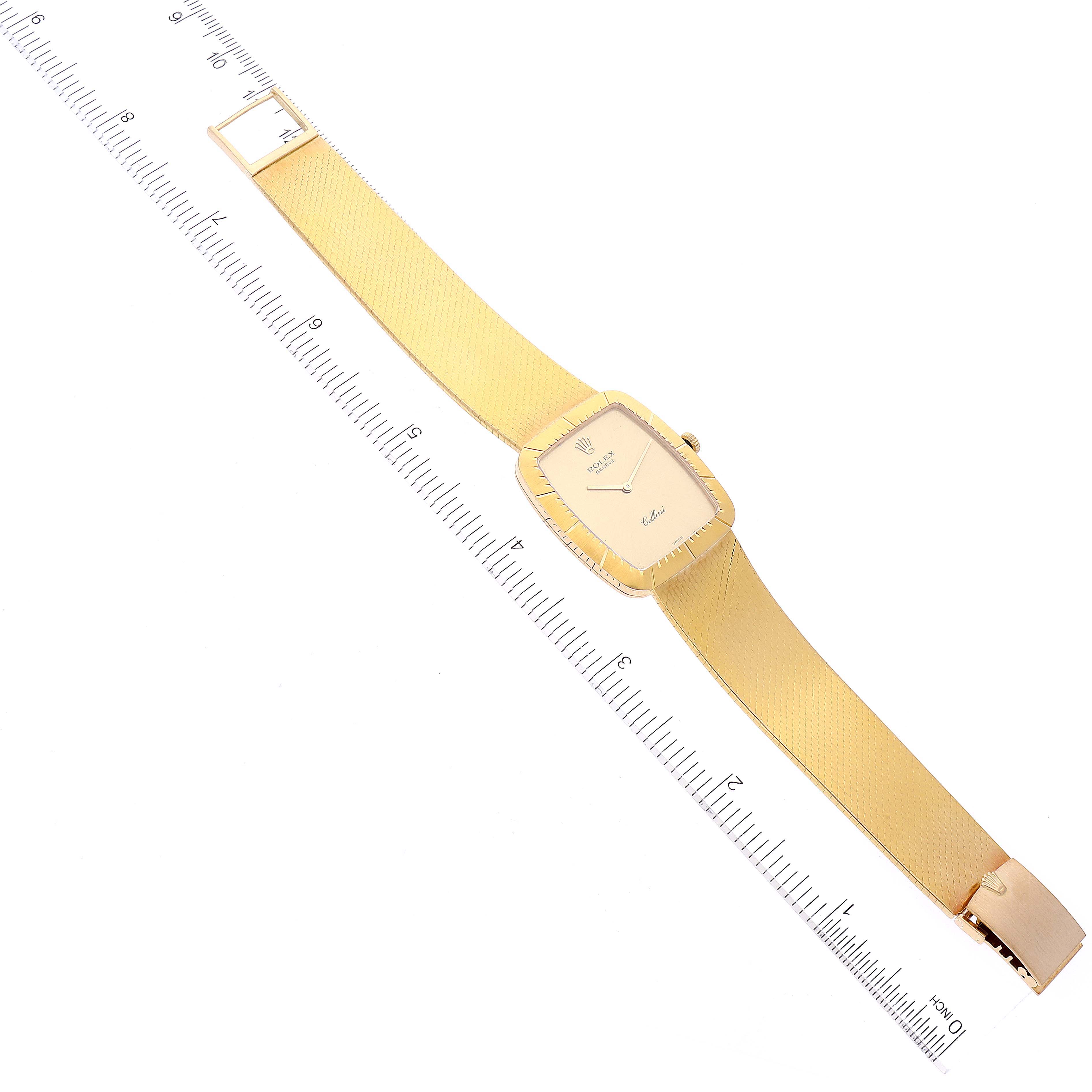 The image shows a top view of a Rolex Cellini 4322 Men's Yellow Gold Champagne Dial 4322 Men's Yellow Gold Champagne Dial watch with the entire band and face displayed alongside a measurement ruler.