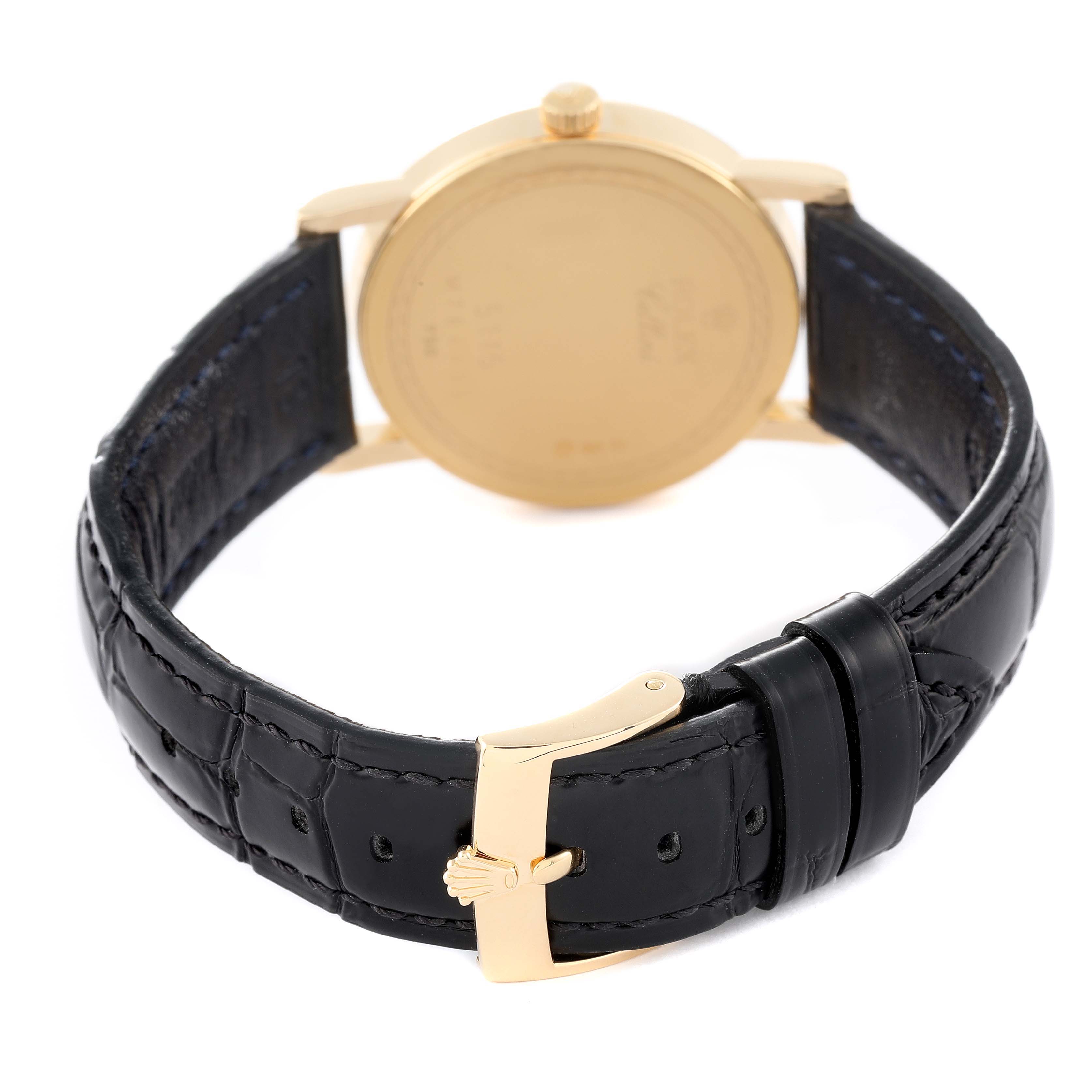 The image shows the back view of a Rolex Cellini 5115 Men's Yellow Gold Beige Dial 5115 Men's Yellow Gold Beige Dial watch, highlighting its black leather strap and gold buckle.