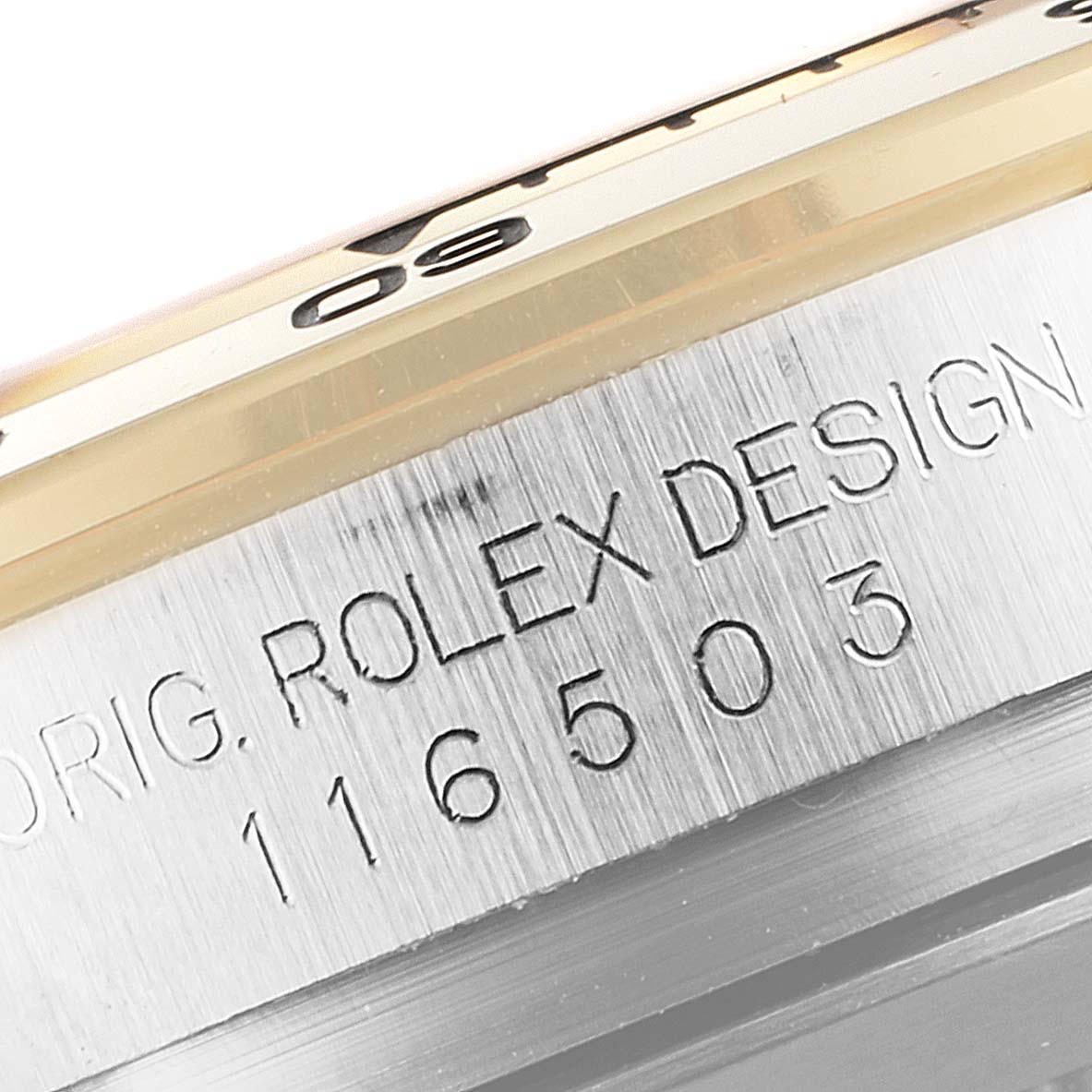 This close-up angle shows the case side of the Rolex Daytona 116503 Men's Steel and Gold (two tone) Black Dial 116503 Men's Steel and Gold (two tone) Black Dial, highlighting the engraved model number.