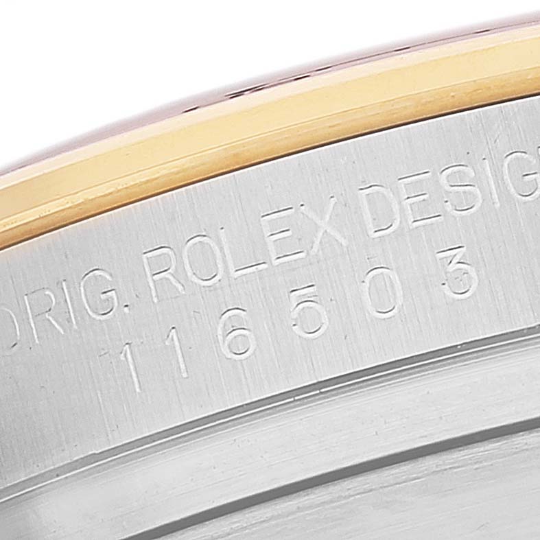 This image shows a close-up of the engraved case number on a Rolex Daytona 116503 Men's Steel and Gold (two tone) Black Dial 116503 Men's Steel and Gold (two tone) Black Dial watch.