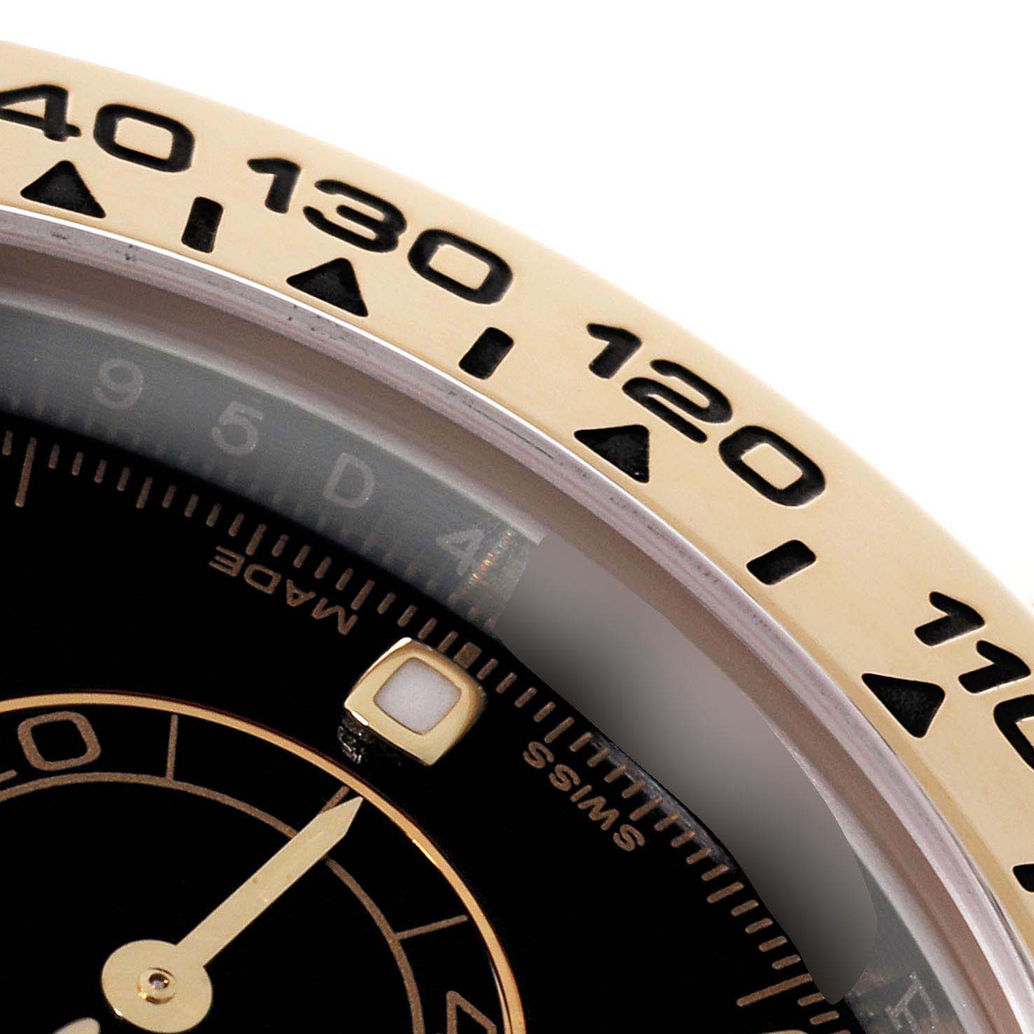 Close-up of the bezel and part of the dial on a Rolex Daytona 116503 Men's Steel and Gold (two tone) Black Dial 116503 Men's Steel and Gold (two tone) Black Dial watch, showing the tachymeter scale and watch markers.