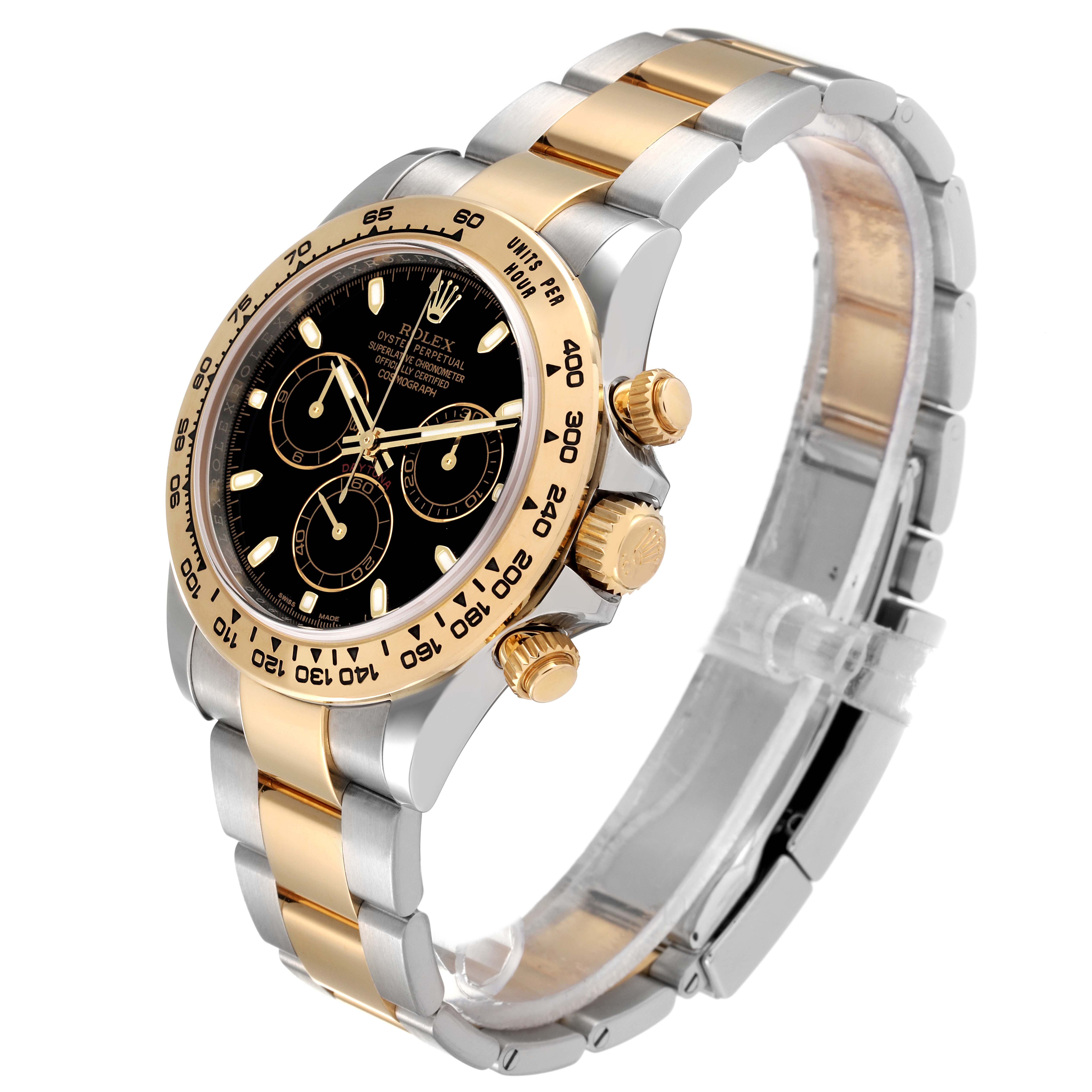 The Rolex Daytona 116503 Men's Steel and Gold (two tone) Black Dial 116503 Men's Steel and Gold (two tone) Black Dial watch is shown at an angled side view, highlighting its dial, bezel, pushers, crown, and two-tone bracelet.