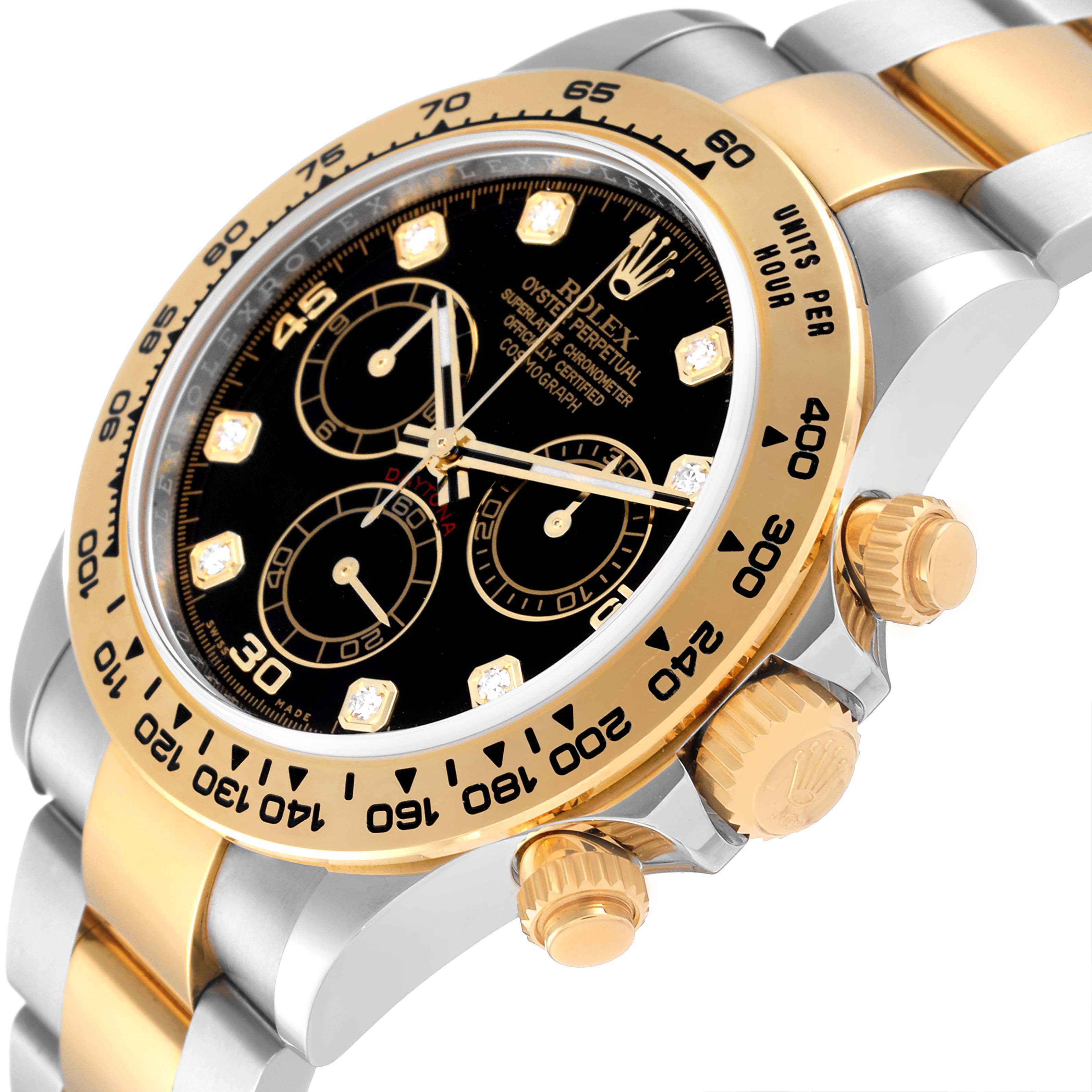 This angle displays the face, bezel, crown, and part of the bracelet of the Rolex Daytona 116503 Men's Steel and Gold (two tone) Black Dial 116503 Men's Steel and Gold (two tone) Black Dial watch.