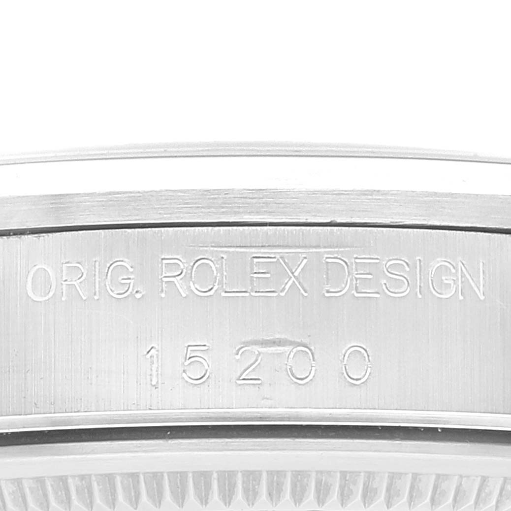 The image shows a close-up of the side case with engraved details of a Rolex Date 15200 Men's Stainless Steel Pink Dial 15200 Men's Stainless Steel Pink Dial model watch.