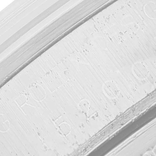 The image shows a close-up of the engravings on the flange or rehaut of a Rolex Date 15200 Men's Stainless Steel Silver Dial 15200 Men's Stainless Steel Silver Dial model.