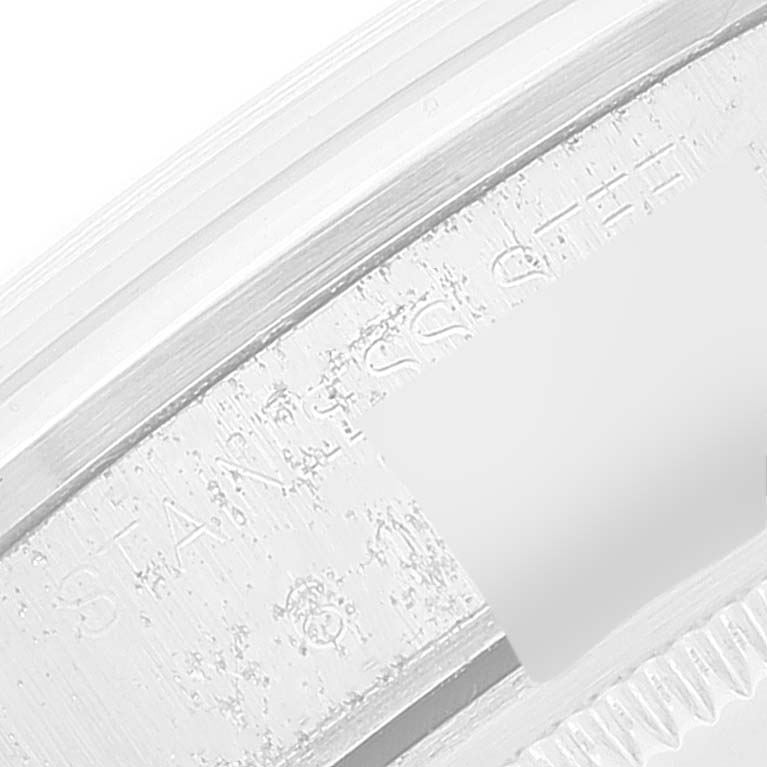 This close-up image shows part of the serial number engraving on the side of the bezel of a Rolex Date 15200 Men's Stainless Steel Silver Dial 15200 Men's Stainless Steel Silver Dial model.
