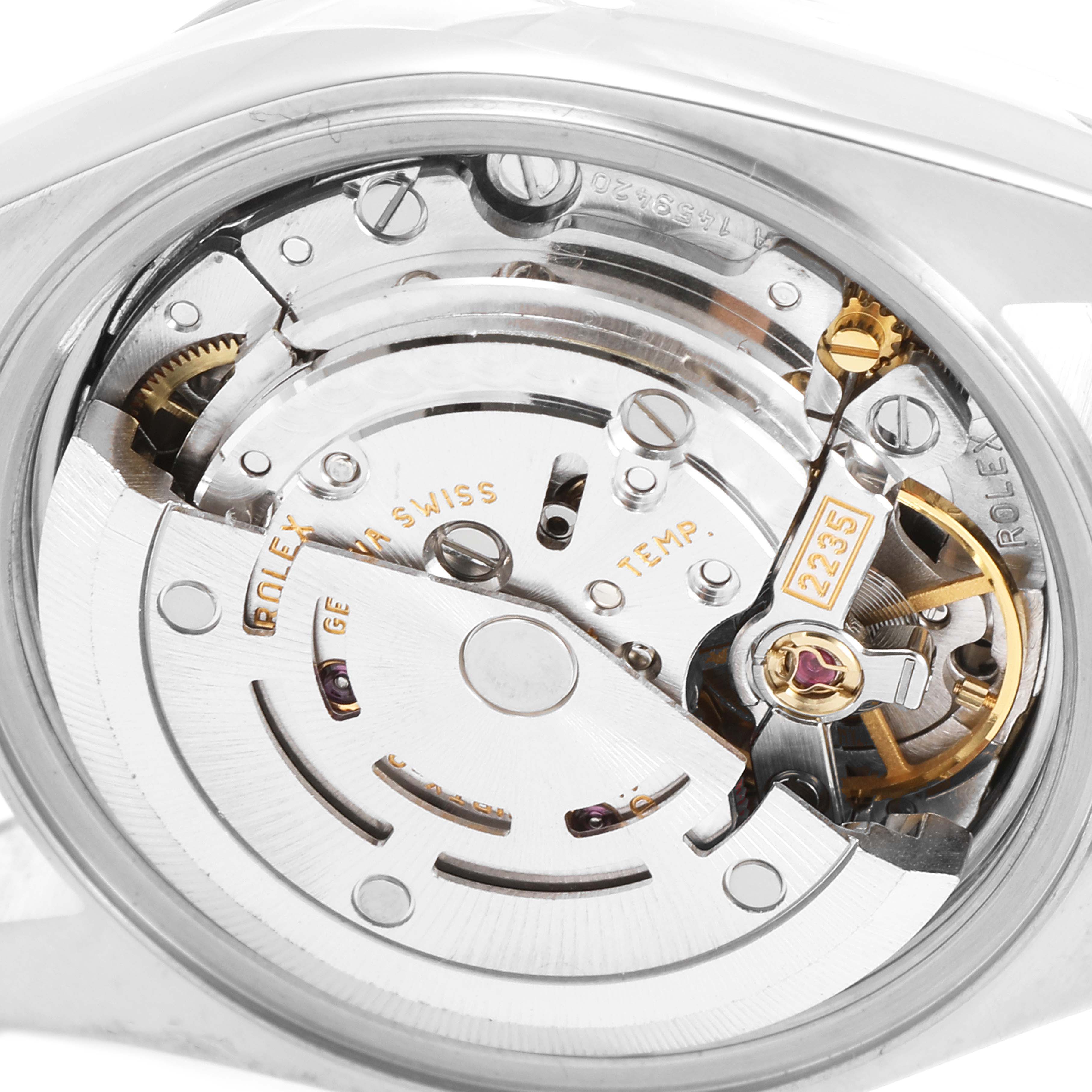 This close-up view of a Rolex Date 79240 Women
s Stainless Steel White Dial 79240 Women
s Stainless Steel White Dial model watch showcases its intricate movement and internal components.