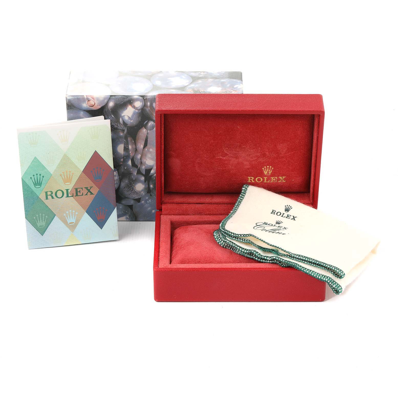 The image shows a Rolex Date 79240 Women
s Stainless Steel White Dial 79240 Women
s Stainless Steel White Dial model watch box, a cleaning cloth, a pamphlet, and an outer box from a front angle.