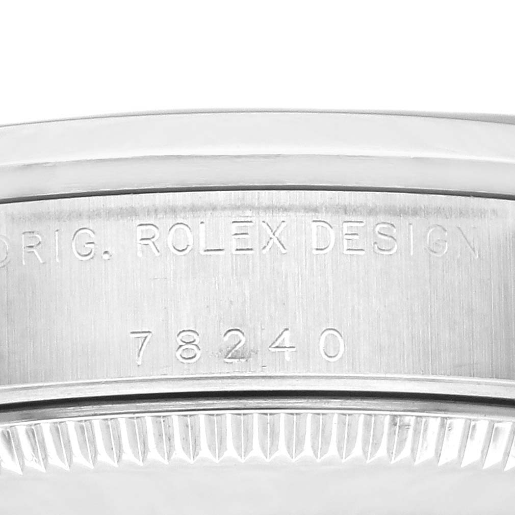 Close-up view of the case side engraving on a Rolex Mid-Size 78240 Women's Stainless Steel Silver Dial 78240 Women's Stainless Steel Silver Dial model watch, showcasing the "ROLEX DESIGN" and model number "78240."