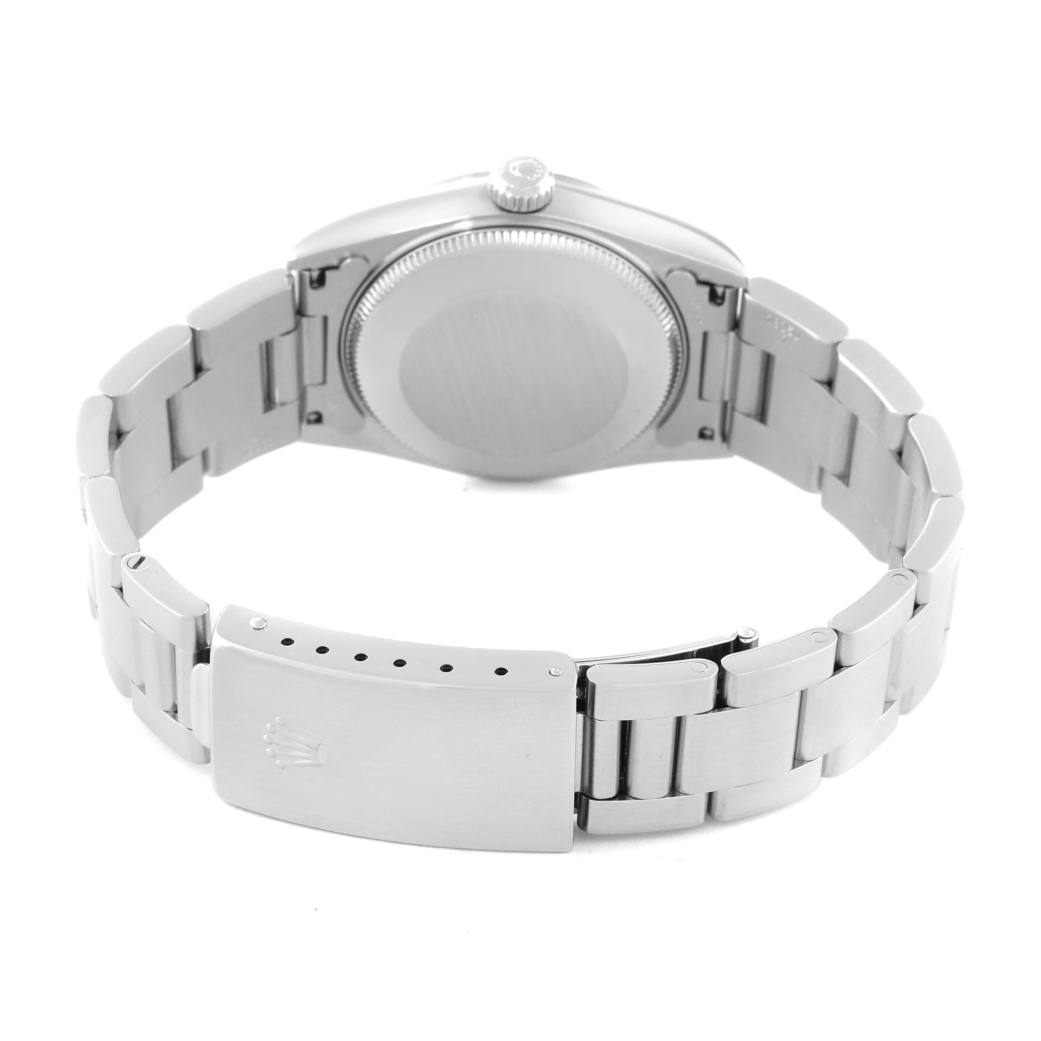 This image shows the back case and bracelet clasp of a Mid-Size Rolex watch at a slight angle.