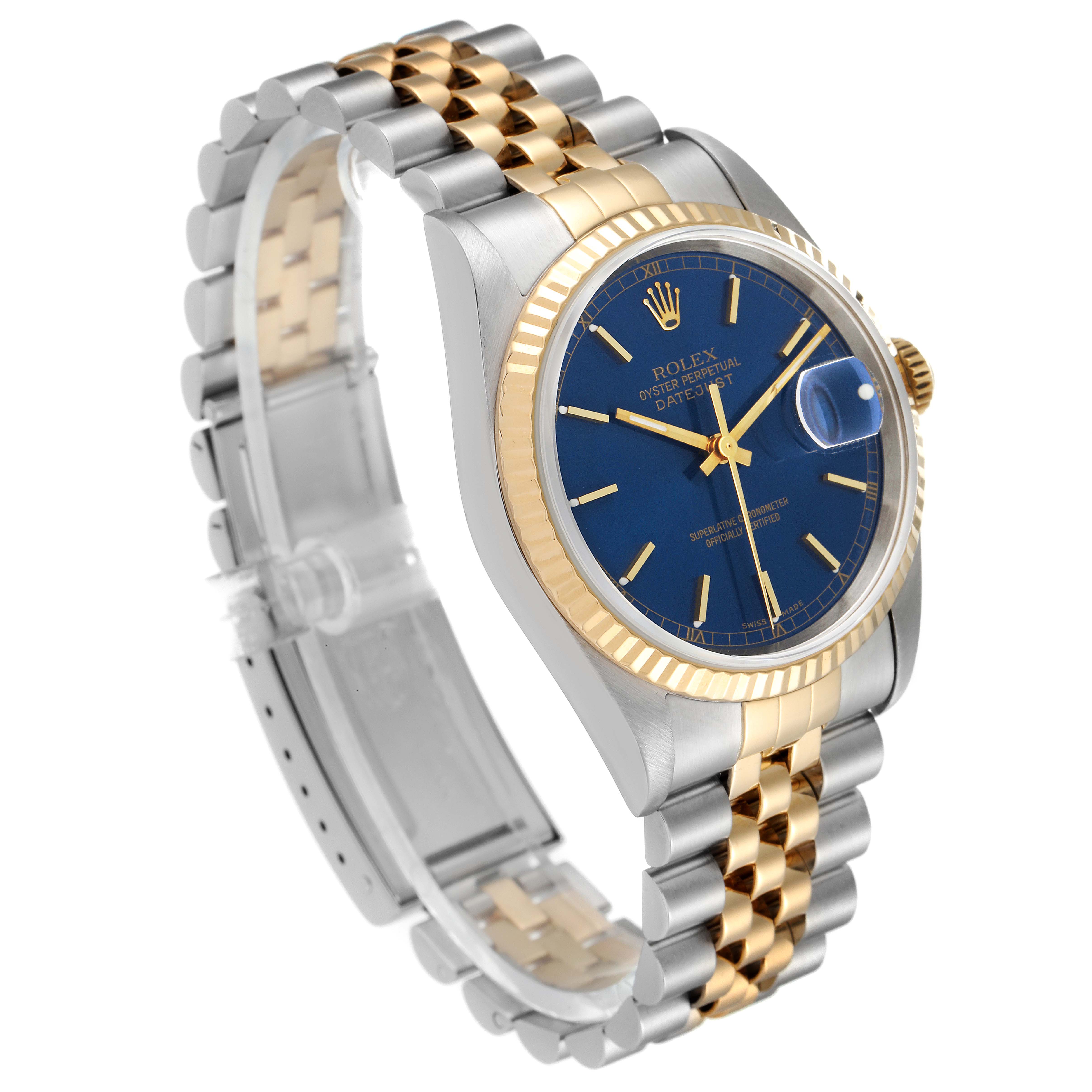 The image shows a Rolex Datejust 16233 Men's Steel and Gold (two tone) Blue Dial 16233 Men's Steel and Gold (two tone) Blue Dial watch at a tilted side angle, highlighting its blue dial, gold bezel, and two-tone bracelet.