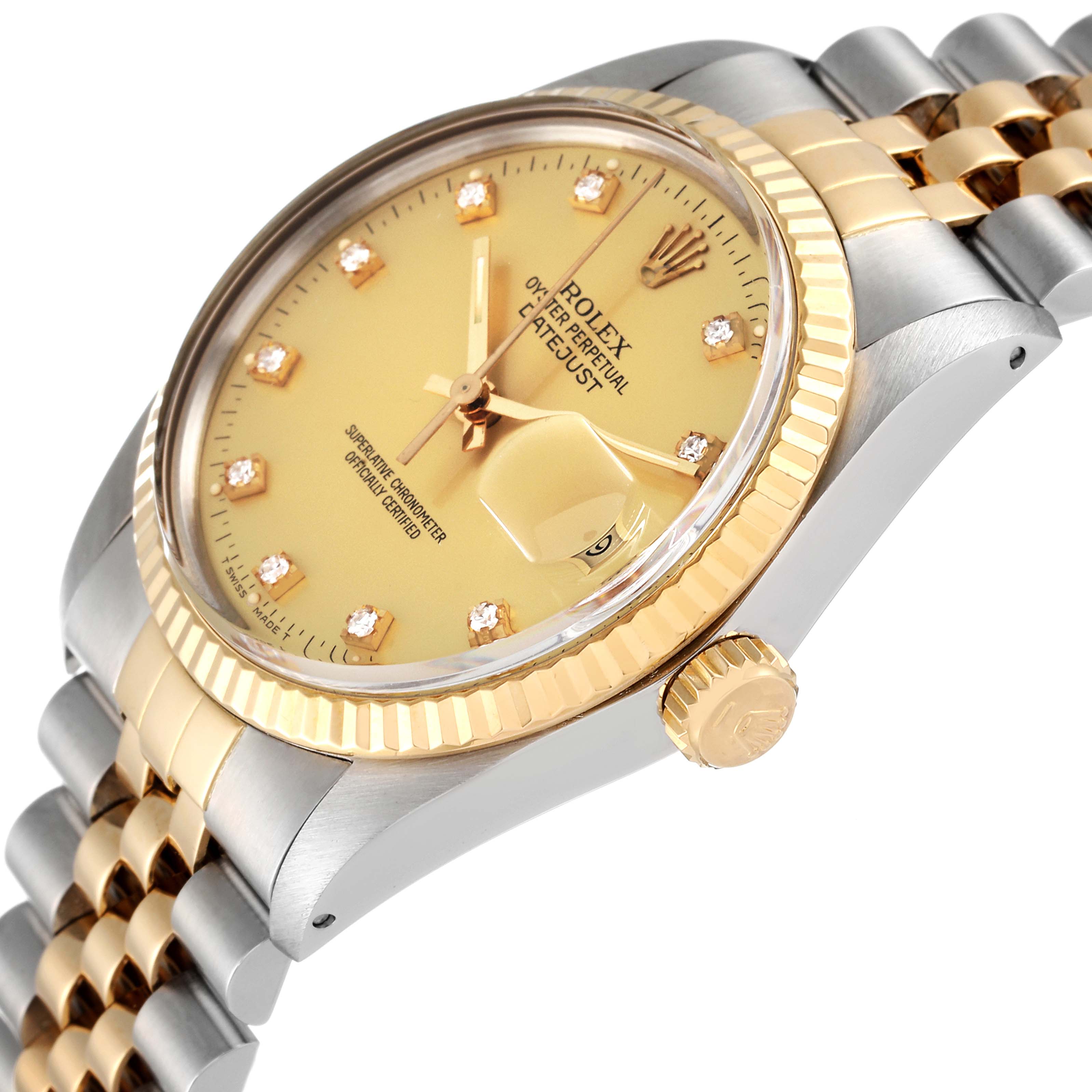 The image shows a close-up angle of a Rolex Datejust 16013 Men
s Steel and Gold (two tone) Champagne Dial 16013 Men
s Steel and Gold (two tone) Champagne Dial watch displaying its dial, crown, case, and part of the bracelet.