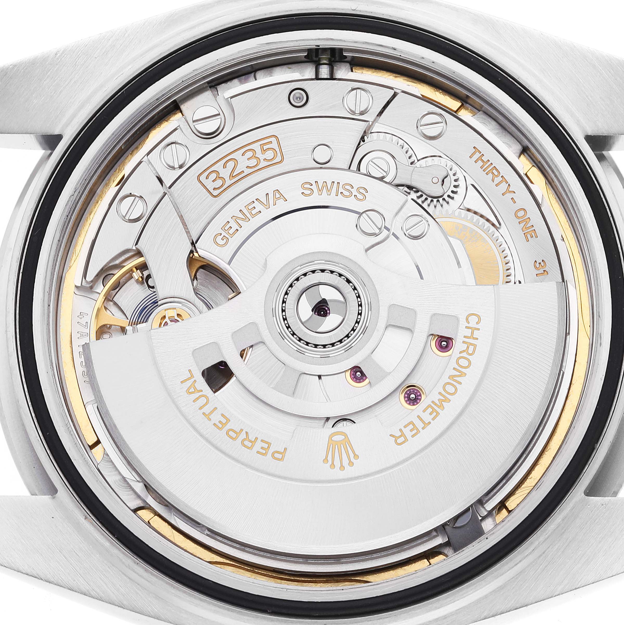 This image shows the back view of the Rolex Datejust 41 126300 Men
s Stainless Steel Green Dial 126300 Men
s Stainless Steel Green Dial, revealing its intricate movement mechanism.