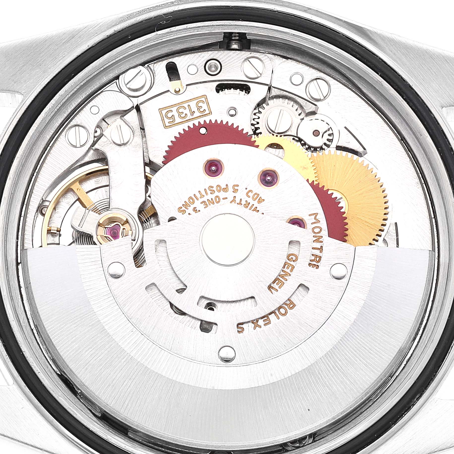 This image shows the inner mechanics of a Rolex Datejust 16220 Men's Stainless Steel Blue Dial 16220 Men's Stainless Steel Blue Dial watch, focusing on the movement and gears from a rear angle.