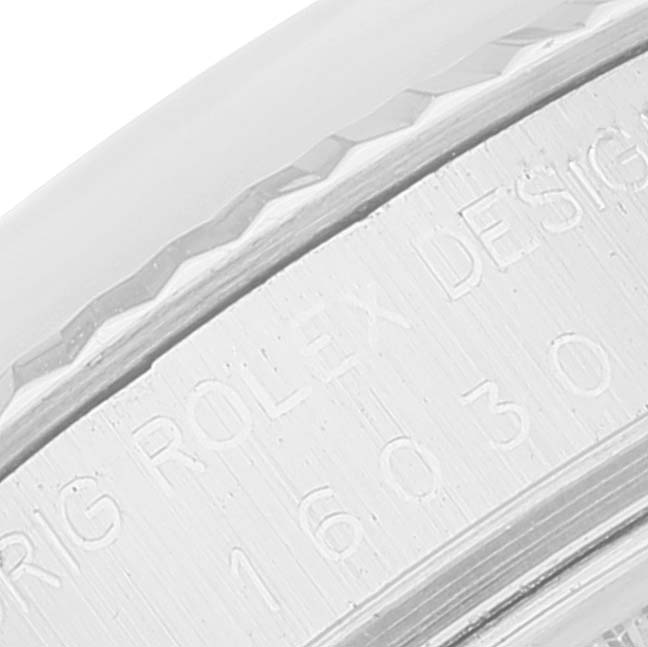 The image shows a close-up of the engraved side of the bezel and case back of a Rolex Vintage Collection 16030 Men's Stainless Steel Blue Dial 16030 Men's Stainless Steel Blue Dial model watch.