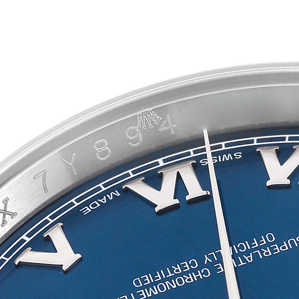 This close-up angle shows the Roman numeral markers, part of the blue dial, and bezel of the Rolex Datejust 116200 Men's Stainless Steel Blue Dial 116200 Men's Stainless Steel Blue Dial watch.