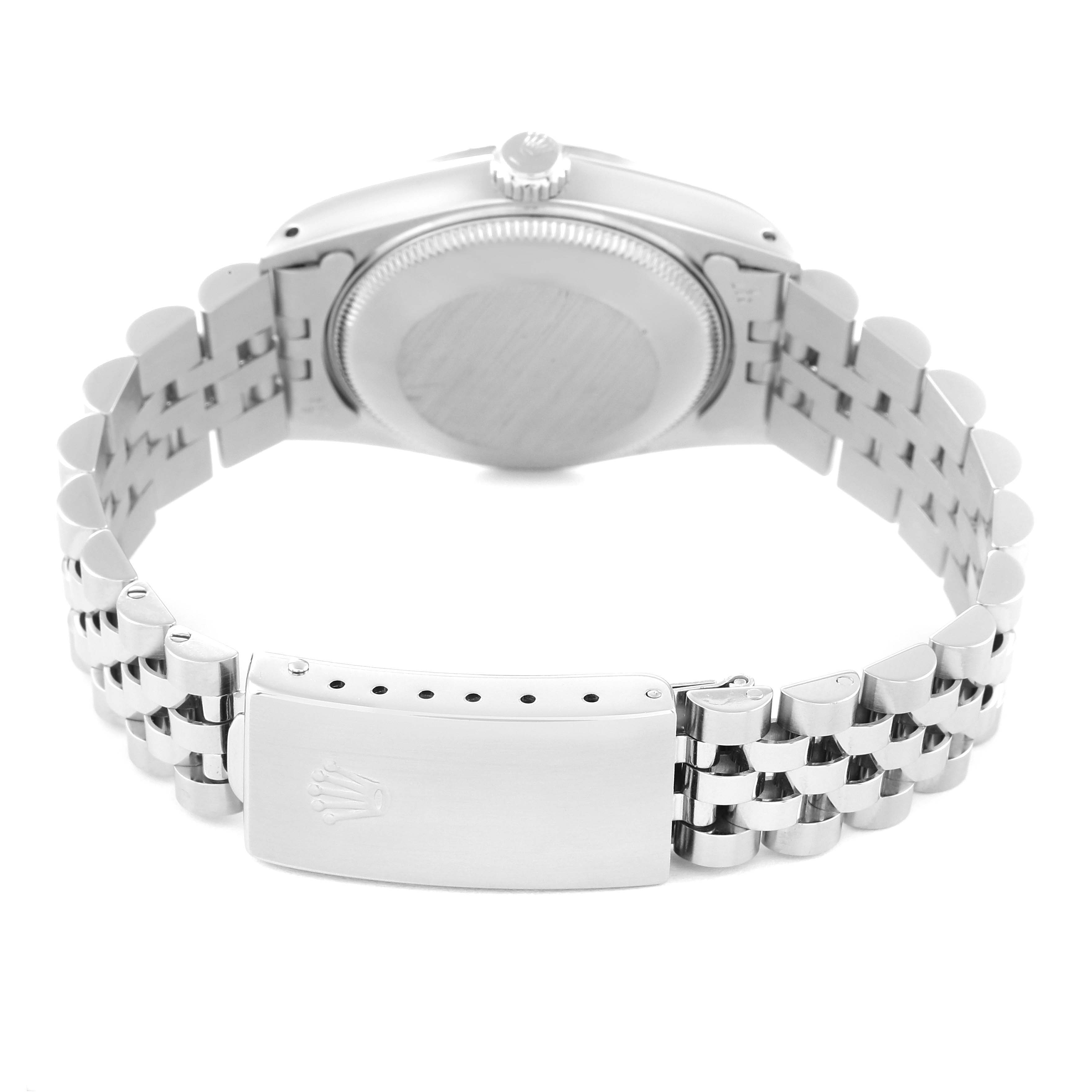 This image shows the back of the mid-size Rolex watch, including its case, crown, and Jubilee bracelet clasp.