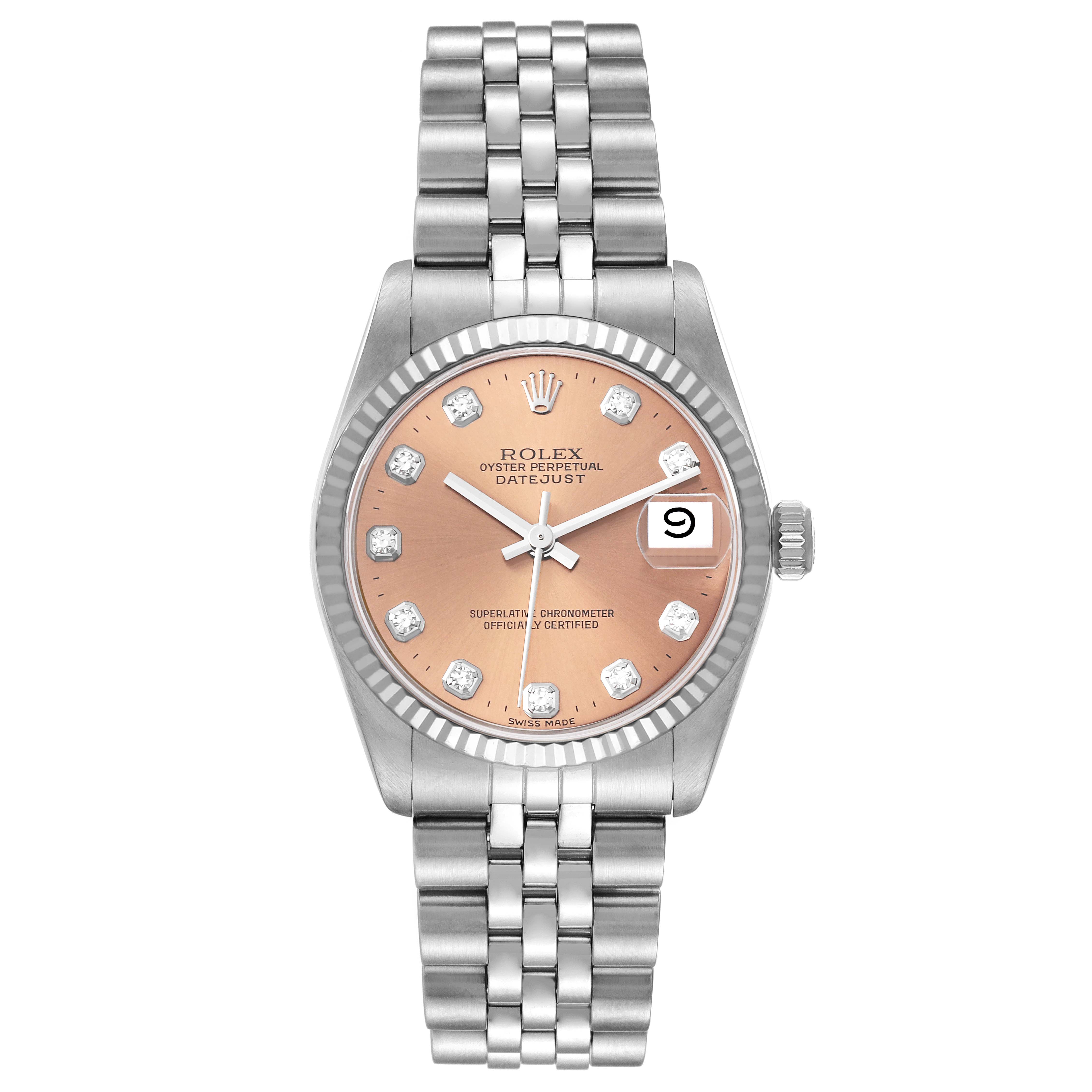 This is a Rolex Mid-Size 68274 Women's Stainless Steel Pink Dial 68274 Women's Stainless Steel Pink Dial Datejust model displayed from a top-down angle, showcasing its face, bezel, and bracelet.