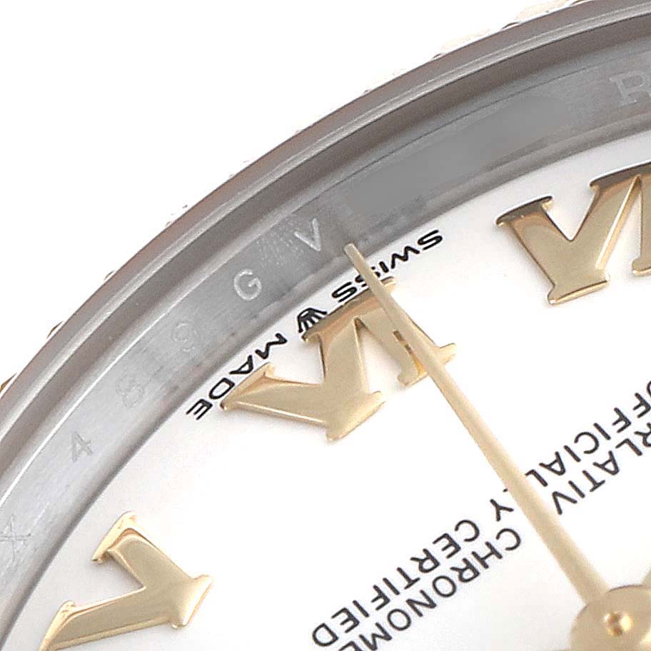 This close-up image of a Rolex Mid-Size 278273 Women
s Steel and Gold (two tone) White Dial 278273 Women
s Steel and Gold (two tone) White Dial watch shows the dial
s Roman numerals and the Swiss-made text.