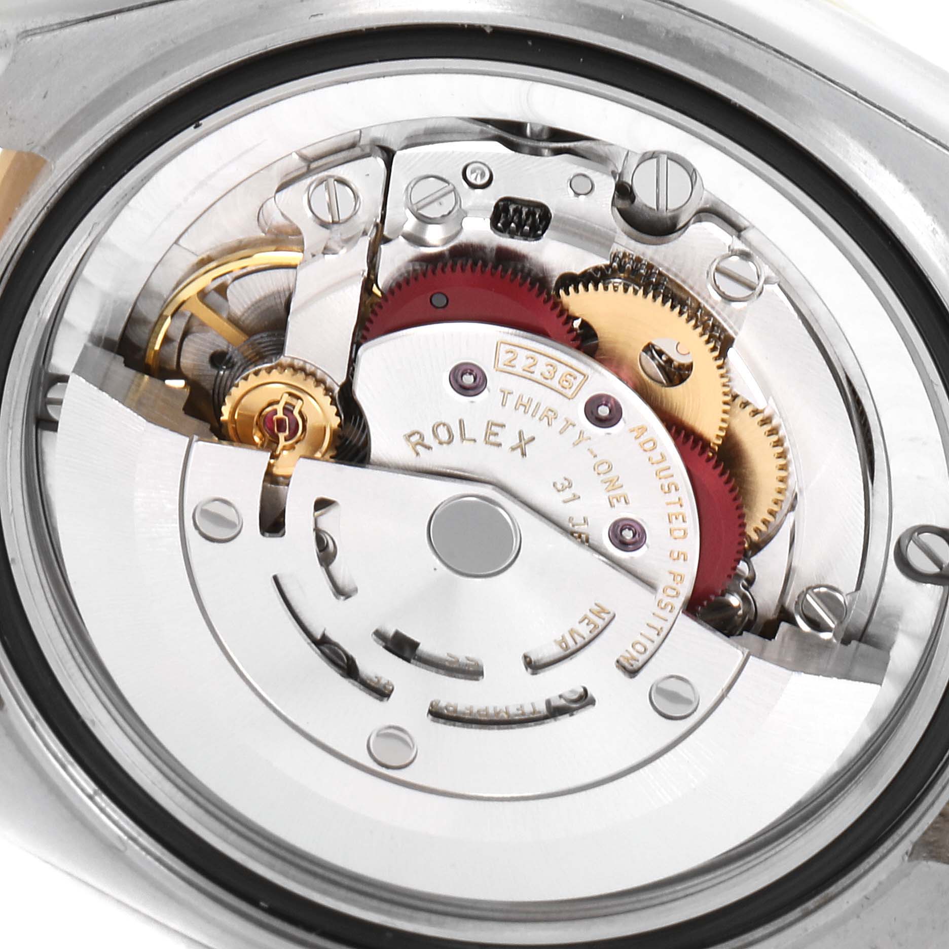 This image shows the inner mechanical movement of a Mid-Size model Rolex watch, viewed from the back.
