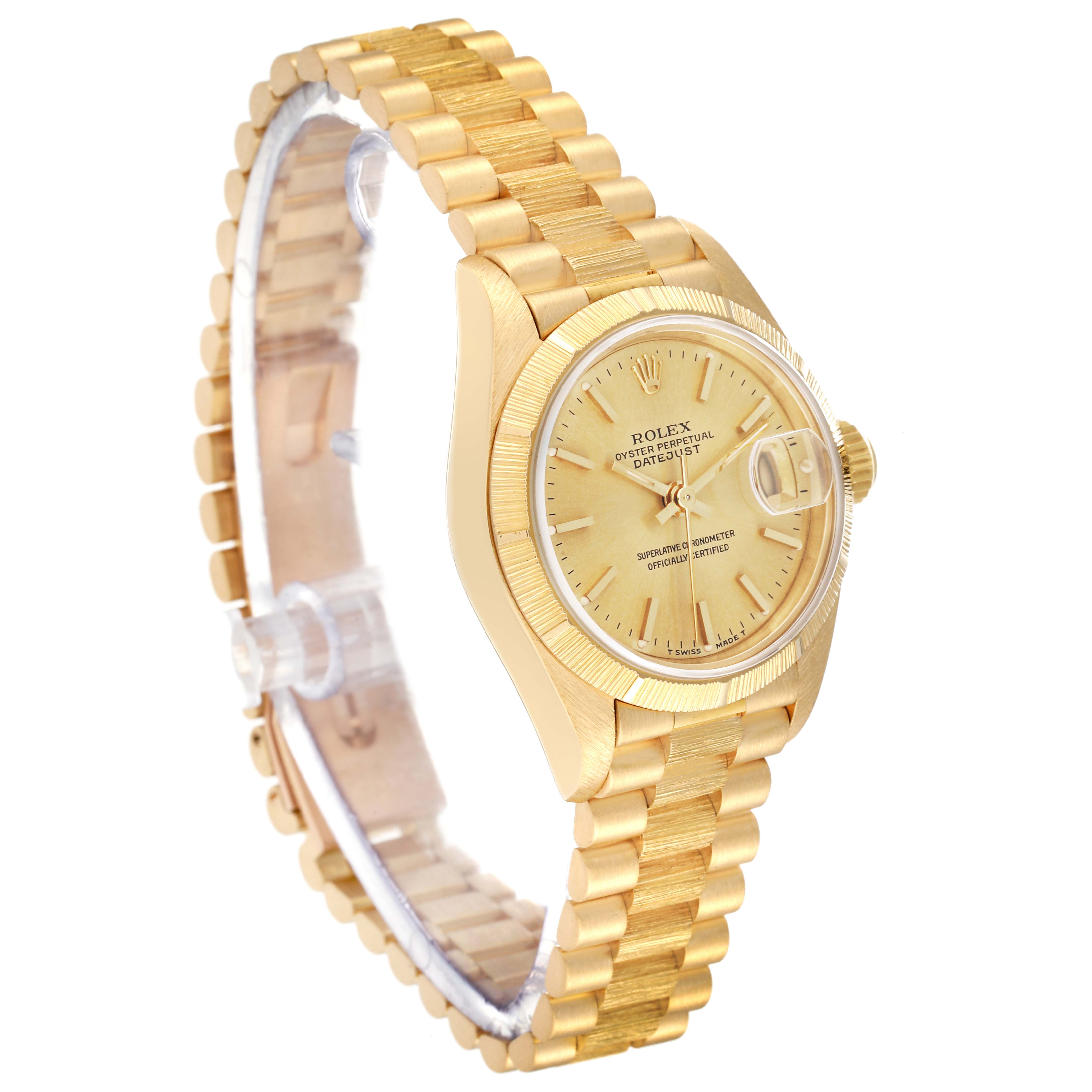 The image shows a side angle view of the Rolex President 69278 Women
s Yellow Gold Champagne Dial 69278 Women
s Yellow Gold Champagne Dial model watch, highlighting the bracelet, bezel, and dial.
