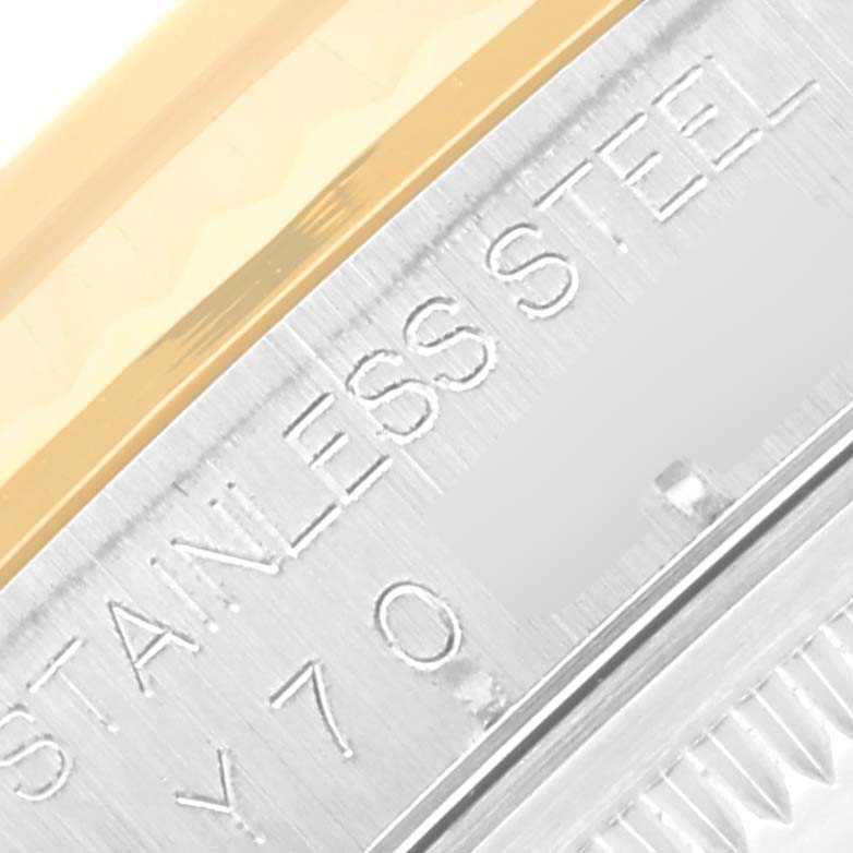 The image shows a close-up of the stainless steel and gold bezel of a Rolex Datejust 16233 Men's Steel and Gold (two tone) Black Dial 16233 Men's Steel and Gold (two tone) Black Dial watch.