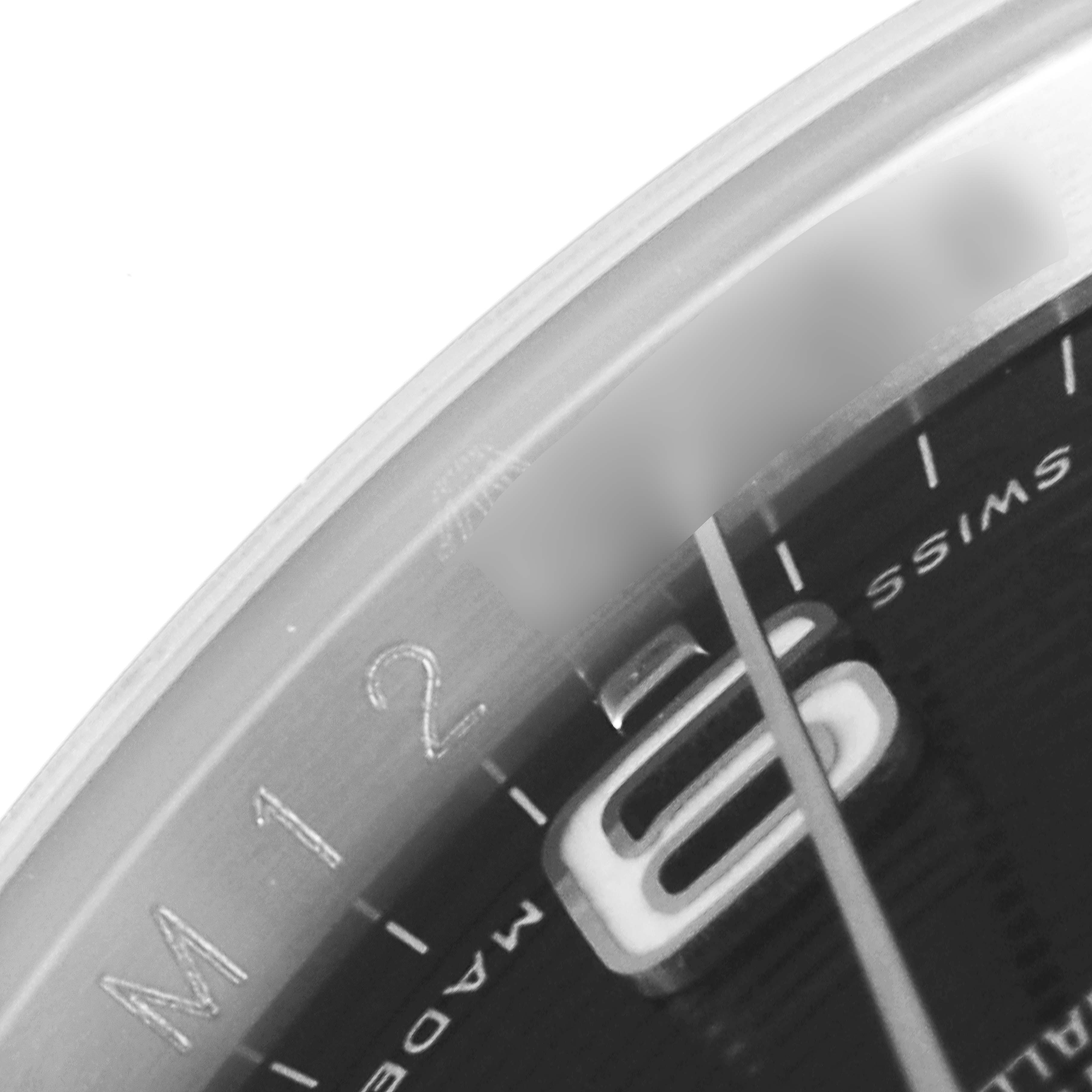 This close-up image shows a portion of the dial and bezel of a Rolex Datejust 116234 Men
s Stainless Steel Black Dial 116234 Men
s Stainless Steel Black Dial watch.