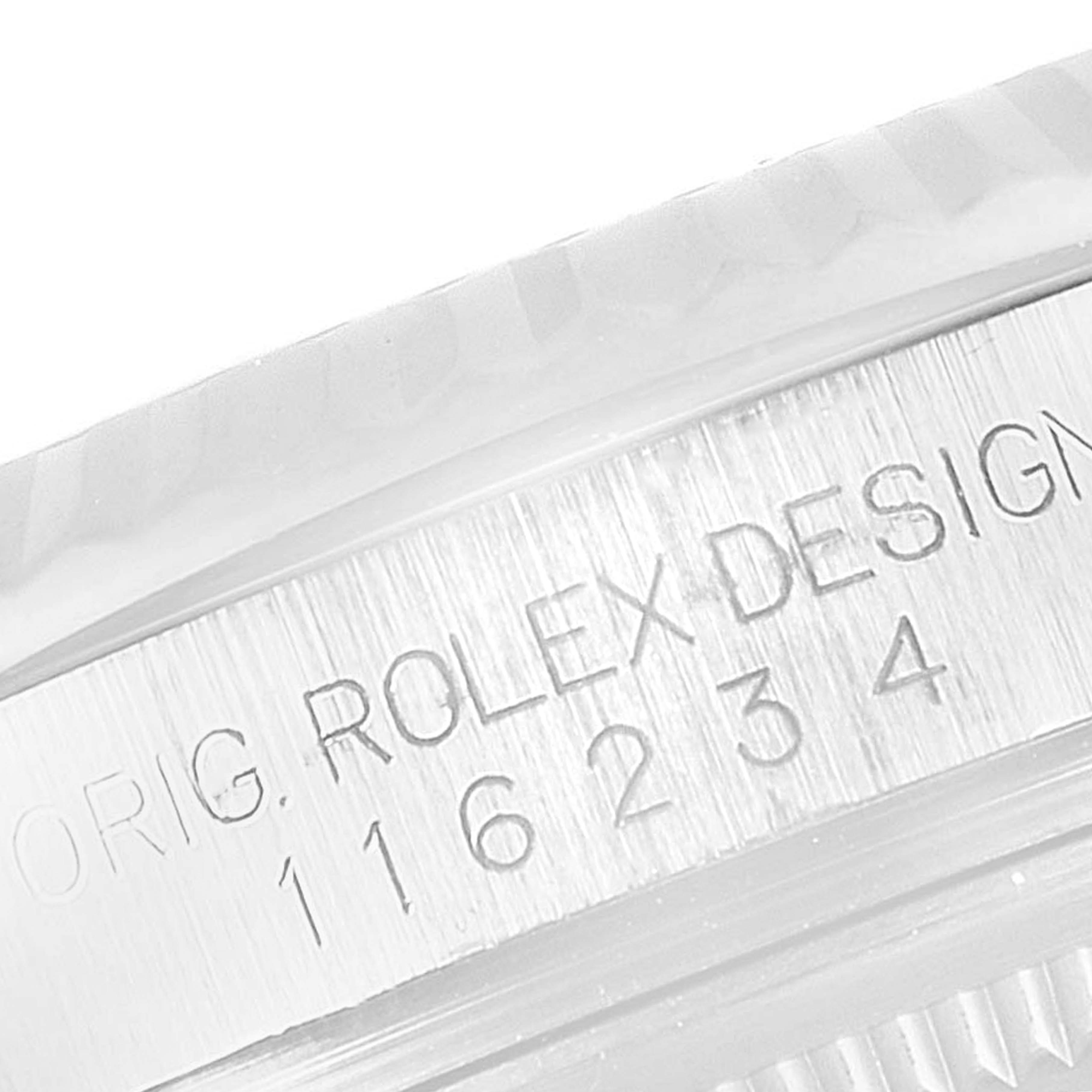 The image shows a close-up of the engraved text on the side of a Rolex Datejust 116234 Men
s Stainless Steel Black Dial 116234 Men
s Stainless Steel Black Dial model watch case.