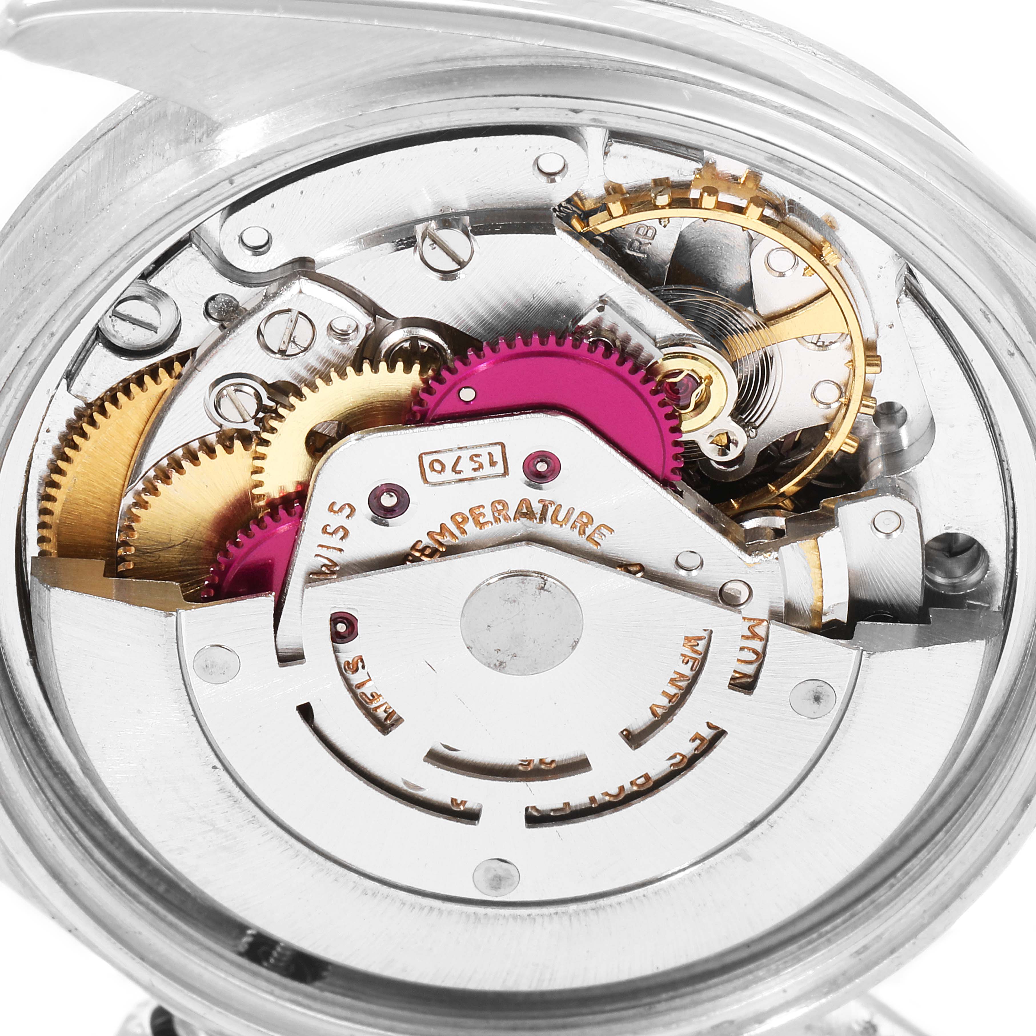 The image shows a close-up of the internal movement mechanism of a Rolex Vintage Collection 1601 Men's Stainless Steel Silver Dial 1601 Men's Stainless Steel Silver Dial watch.