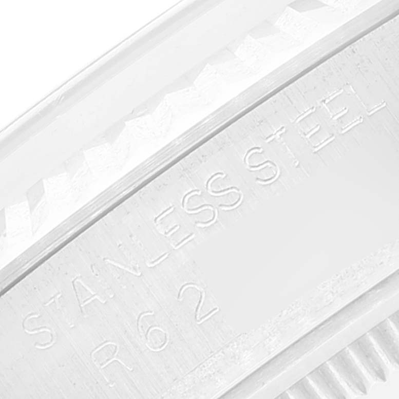 This image shows a close-up of the engraved "STAINLESS STEEL" and model number on the casing of a Vintage Collection Rolex watch.