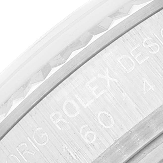 The image shows a close-up of the side of a Rolex Vintage Collection 16014 Men's Stainless Steel Silver Dial 16014 Men's Stainless Steel Silver Dial watch, highlighting the engraved text and bezel details.