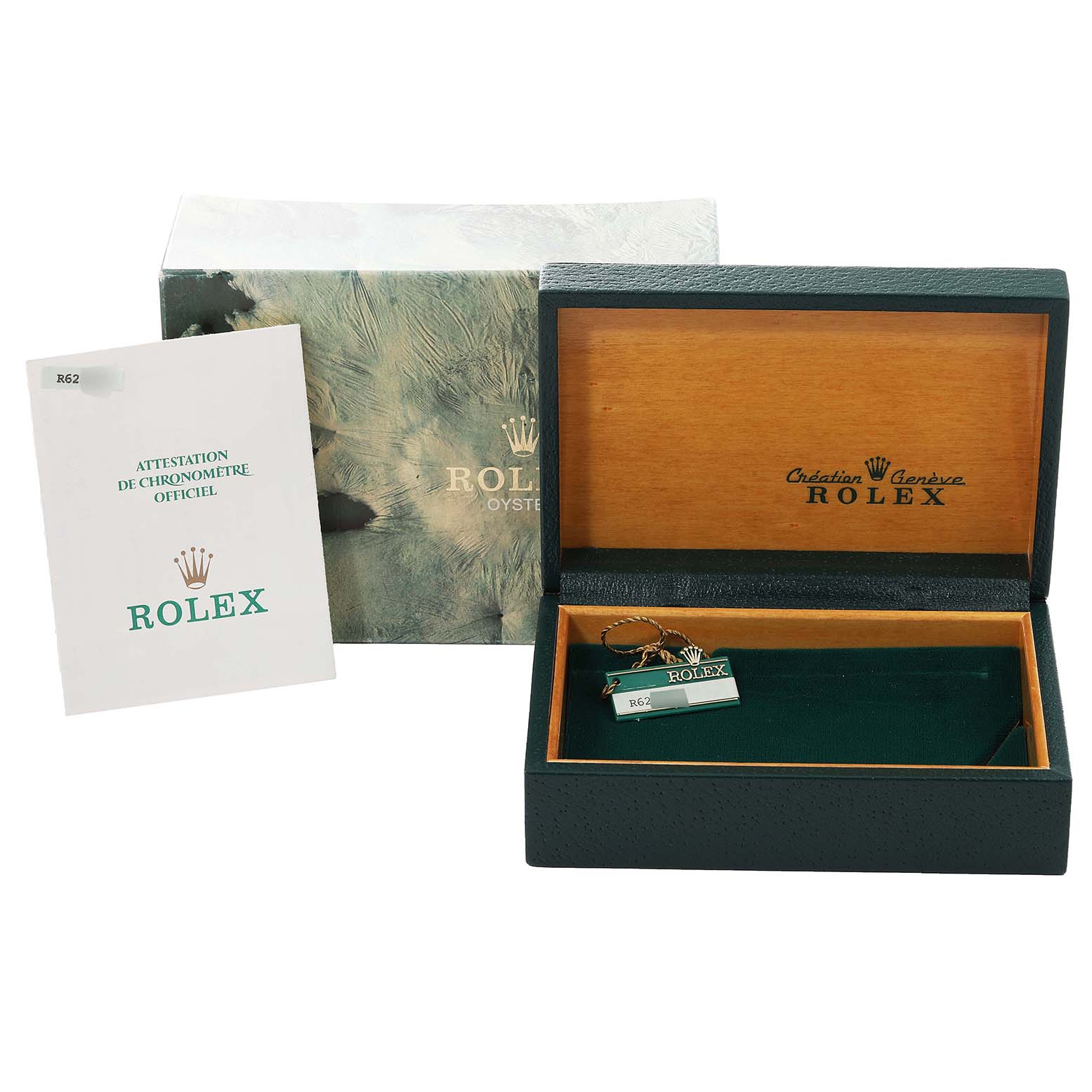 The image shows the box, booklet, and tag of the Vintage Collection model by Rolex, with the box lid open.