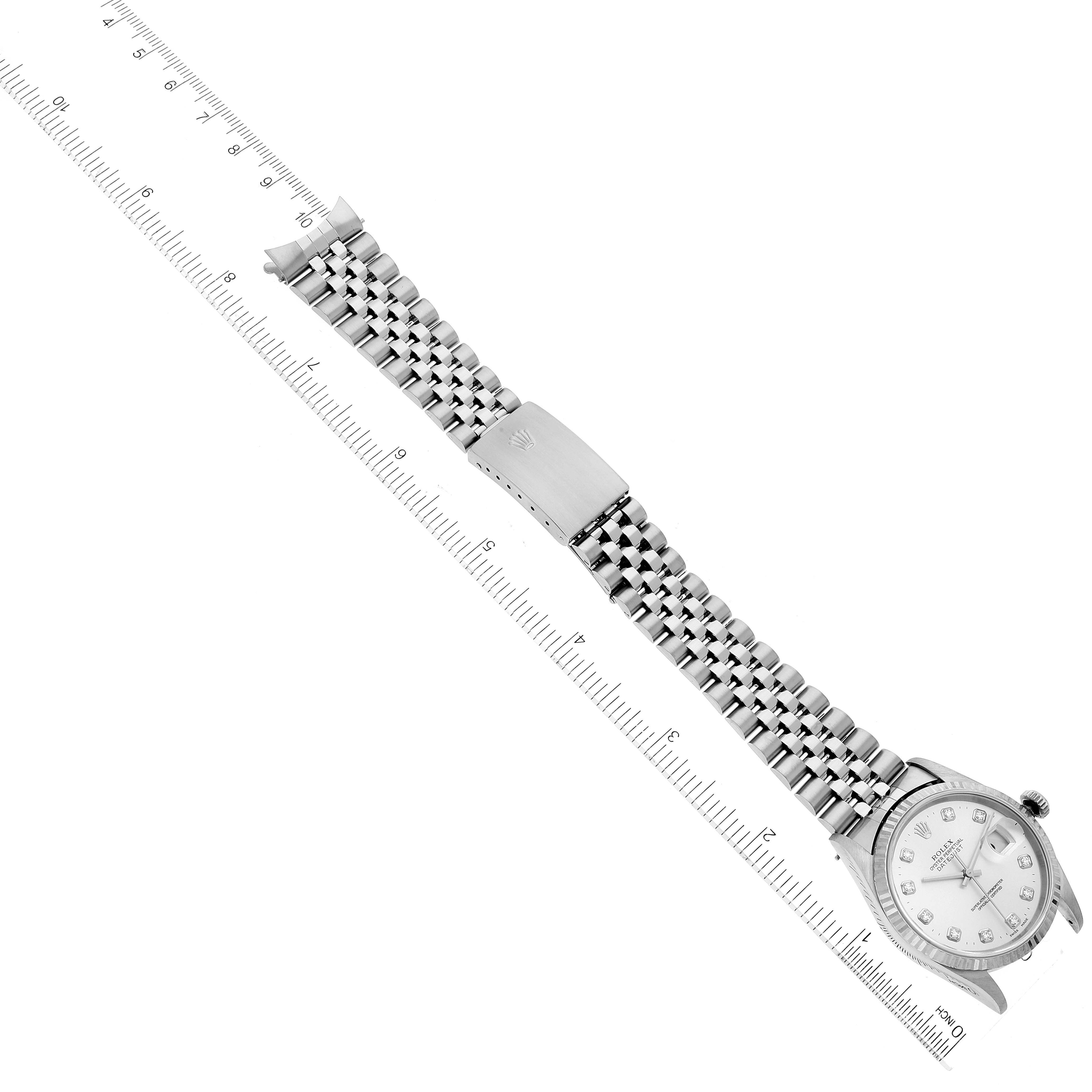 The image shows a Rolex Datejust 16234 Men's Stainless Steel Silver Dial 16234 Men's Stainless Steel Silver Dial watch placed diagonally with its bracelet fully extended alongside a ruler for scale.