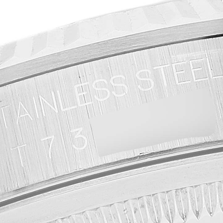 The image shows a close-up of the side engraving on a Rolex Datejust 16234 Men's Stainless Steel Silver Dial 16234 Men's Stainless Steel Silver Dial watch, indicating "STAINLESS STEEL" and part of the model number.