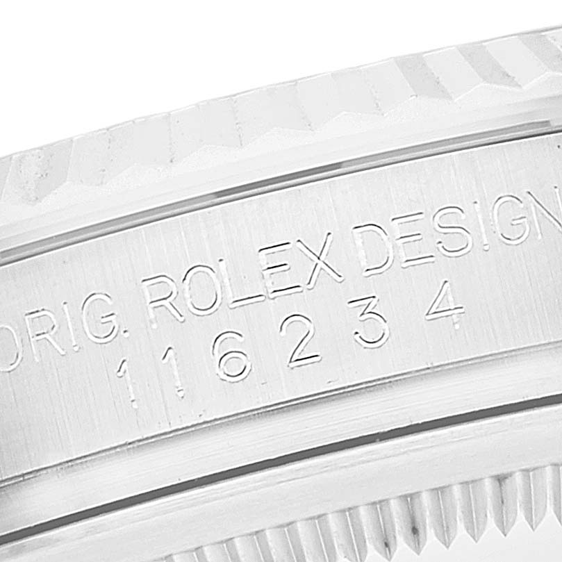 This image shows a close-up of the engraved case side of a Rolex Datejust 116234 Men's Stainless Steel White Dial 116234 Men's Stainless Steel White Dial model, highlighting its model number.